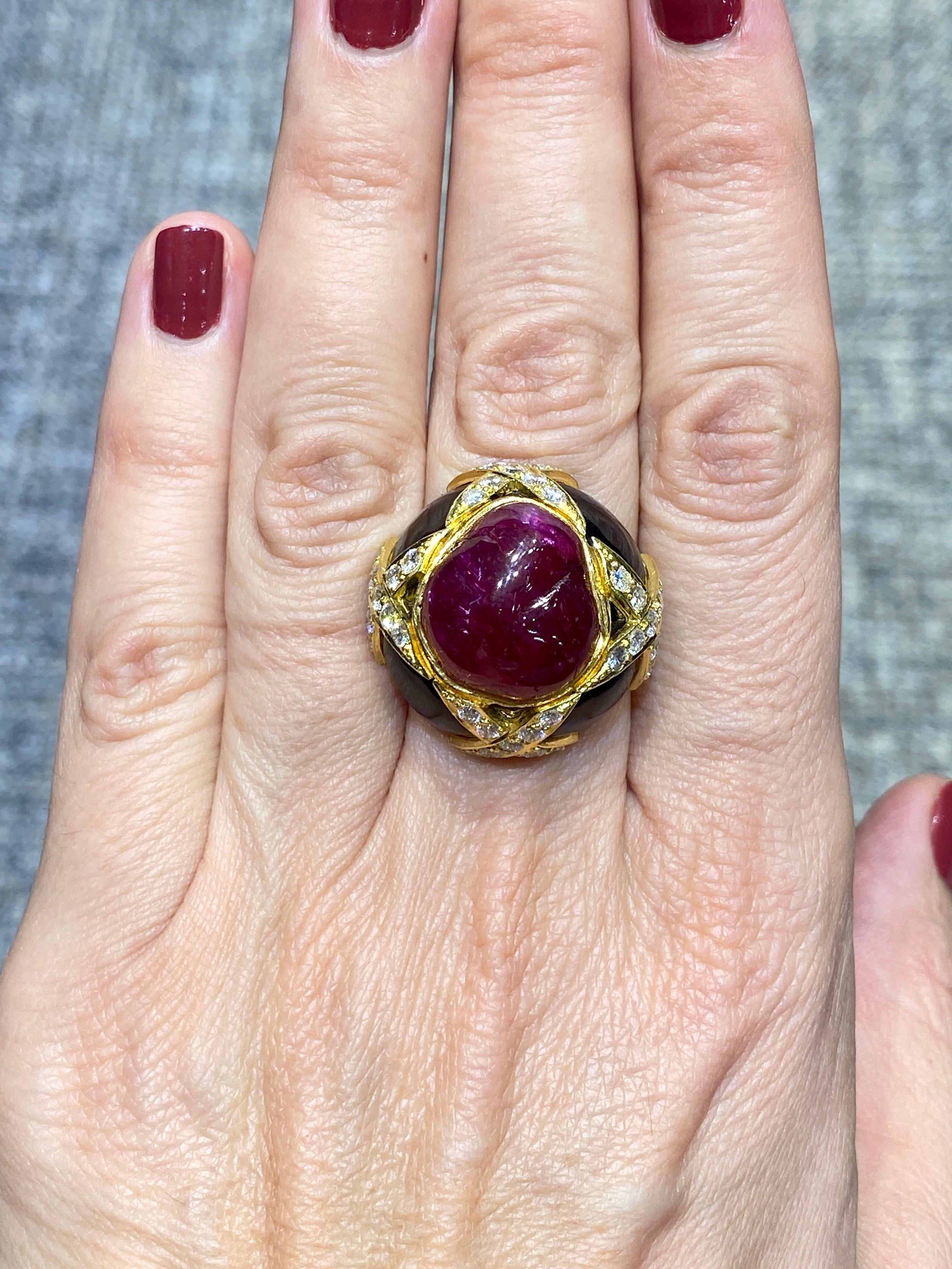 This stunning 1960s cocktail ring is designed around a remarkable unheated natural ruby. It is adorned with onyx and diamonds and set in 18 k gold. It is a beauty to behold.