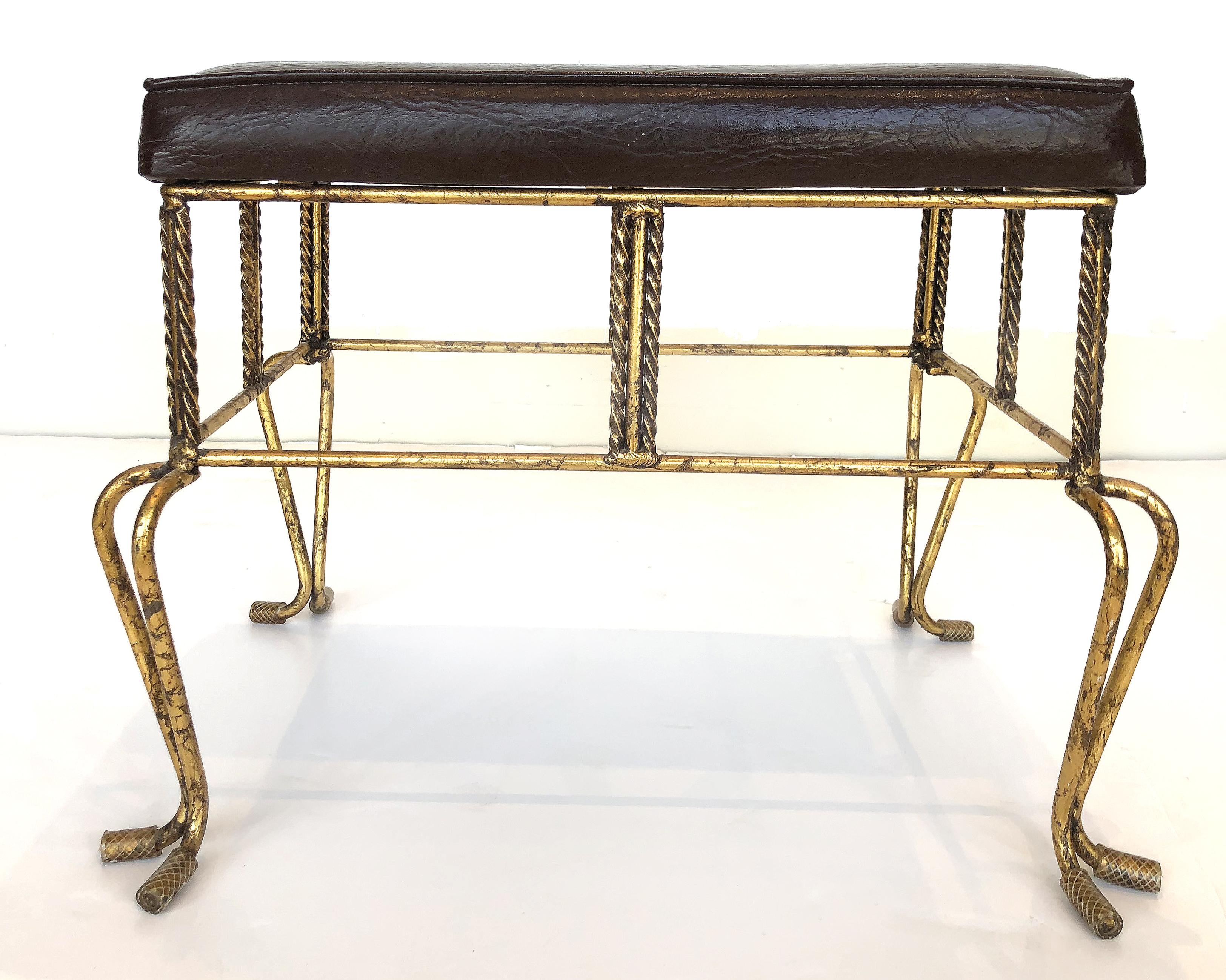 1960s European Hollywood Regency gilt-iron bench / stool


Offered for sale is an upholstered 1960s European Hollywood Regency gilt-iron bench or stool created in the manner of Tony Duquette. The bench is quite substantial while having an elegant