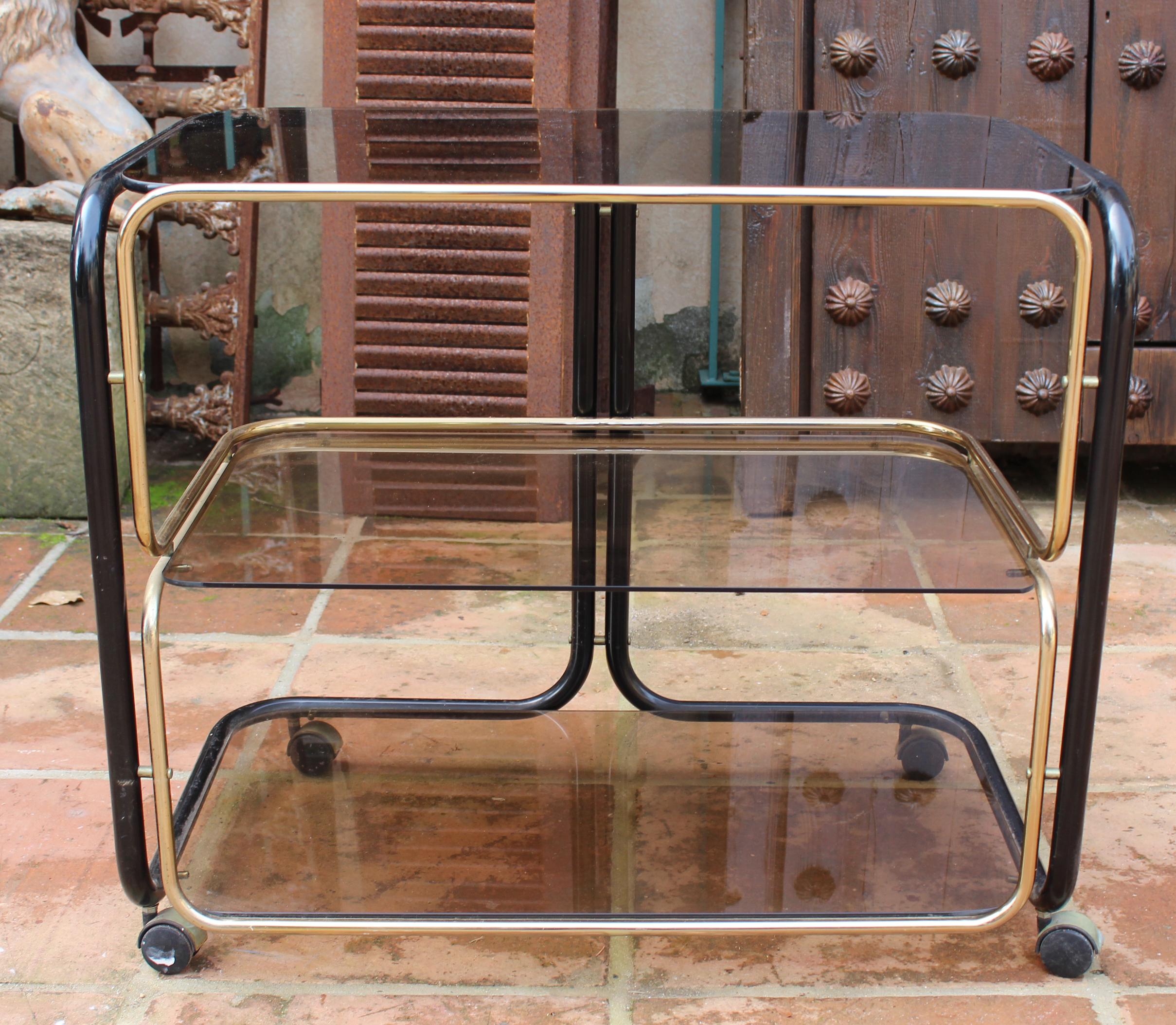 1960s European vintage two-tone metal smoked glass drinks trolley.