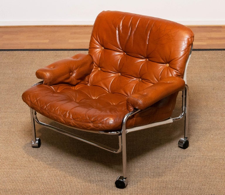 Mid-Century Modern 1960s Eva Lounge Chair Chrome and Aged Brown / Tan Leather by Lindlöfs Möbler 1 For Sale