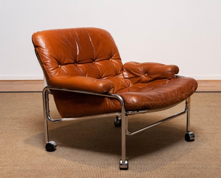 Mid-20th Century 1960s Eva Lounge Chair Chrome and Aged Brown / Tan Leather by Lindlöfs Möbler 1 For Sale