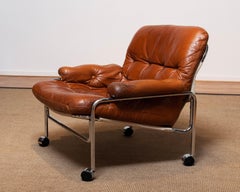 1960s Eva Lounge Chair Chrome and Aged Brown / Tan Leather by Lindlöfs Möbler