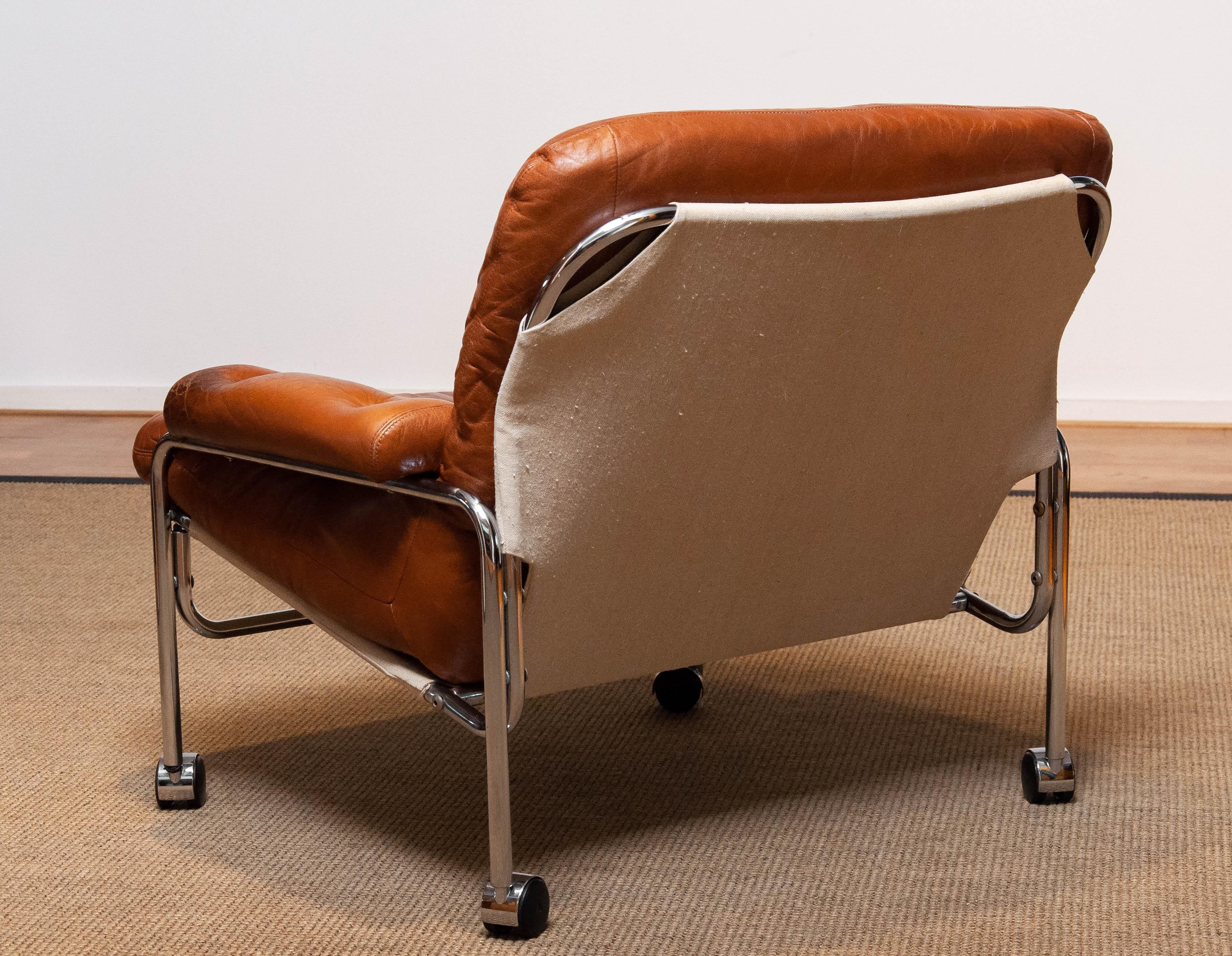 Mid-Century Modern 1960s Eva Lounge Chair Chrome and Aged Brown / Tan Leather by Lindlöfs Möbler 