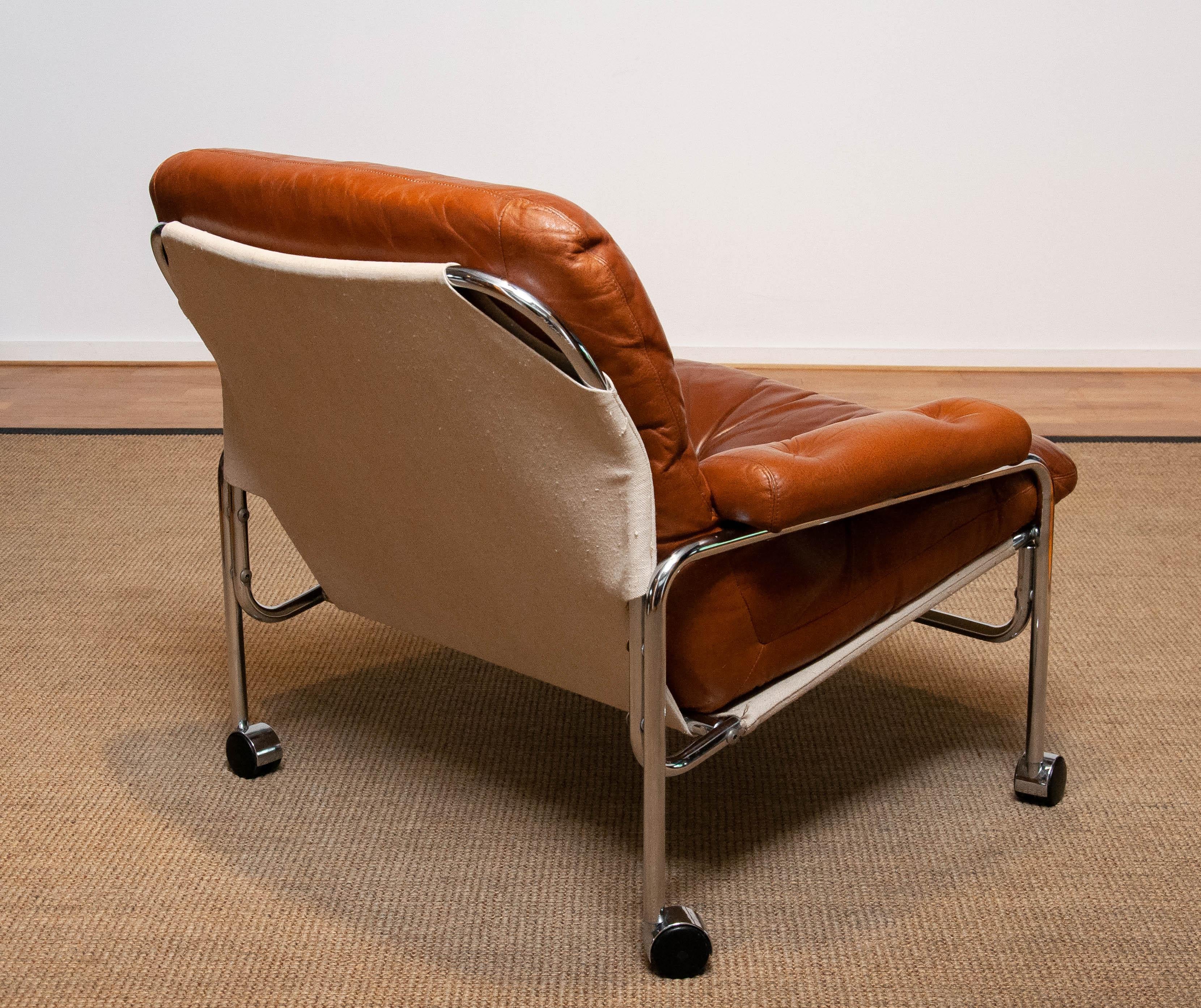 Swedish 1960s Eva Lounge Chair Chrome and Aged Brown / Tan Leather by Lindlöfs Möbler 