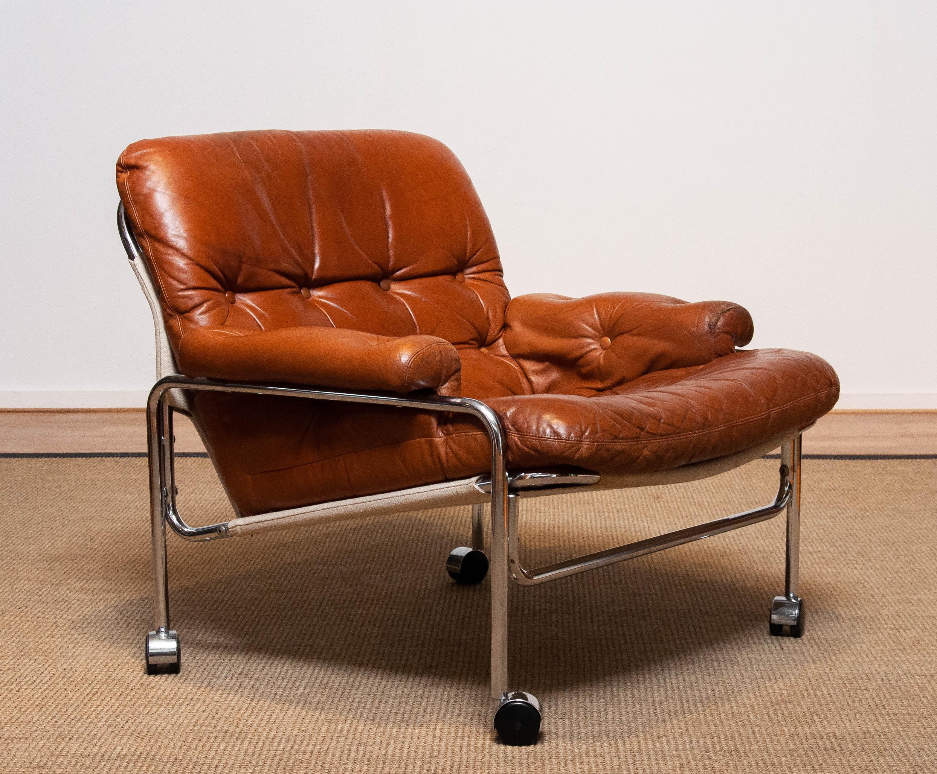 Swedish 1960s Eva Lounge Chair Chrome and Aged Brown / Tan Leather by Lindlöfs Möbler
