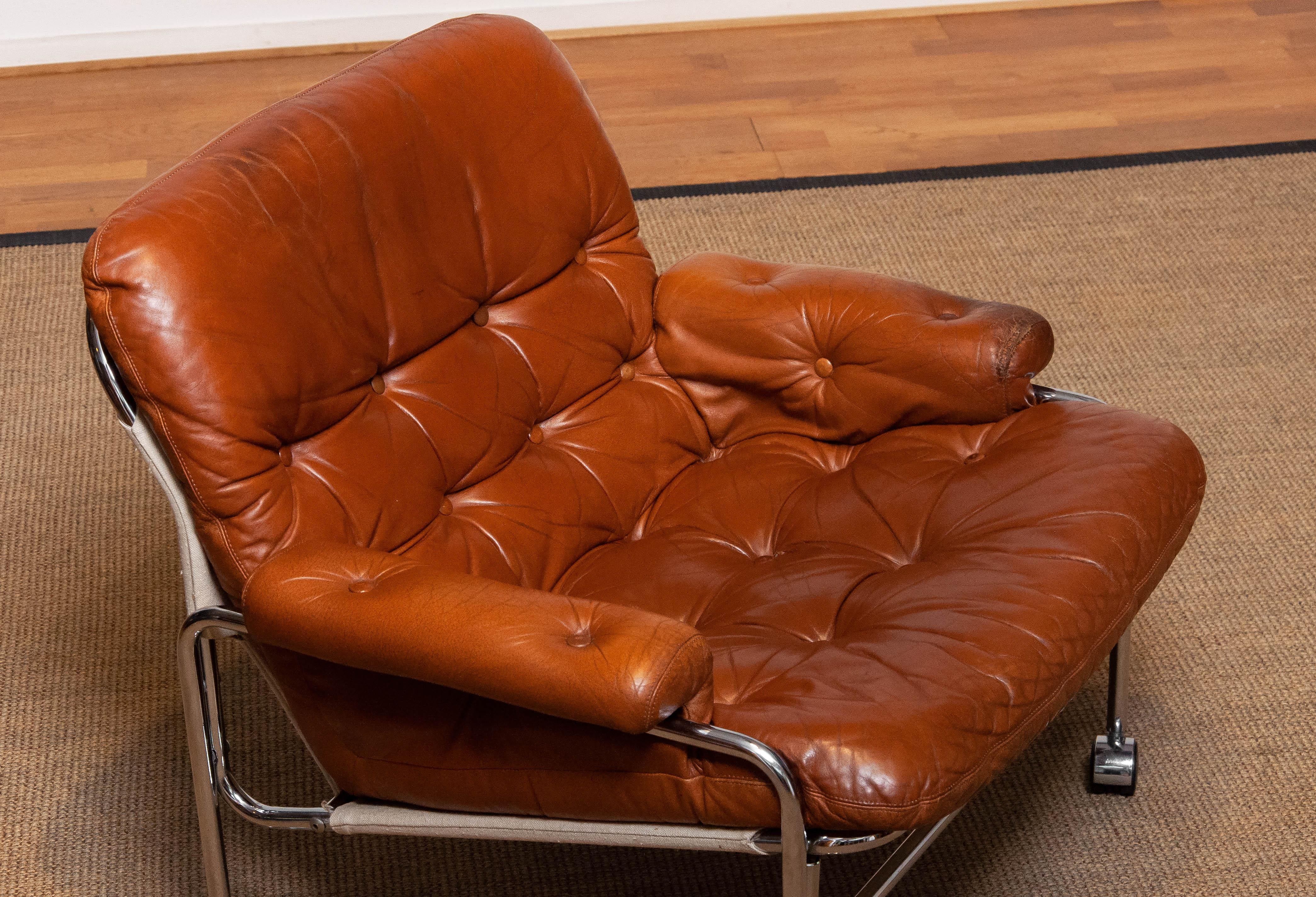 1960s Eva Lounge Chair Chrome and Aged Brown / Tan Leather by Lindlöfs Möbler  In Good Condition In Silvolde, Gelderland