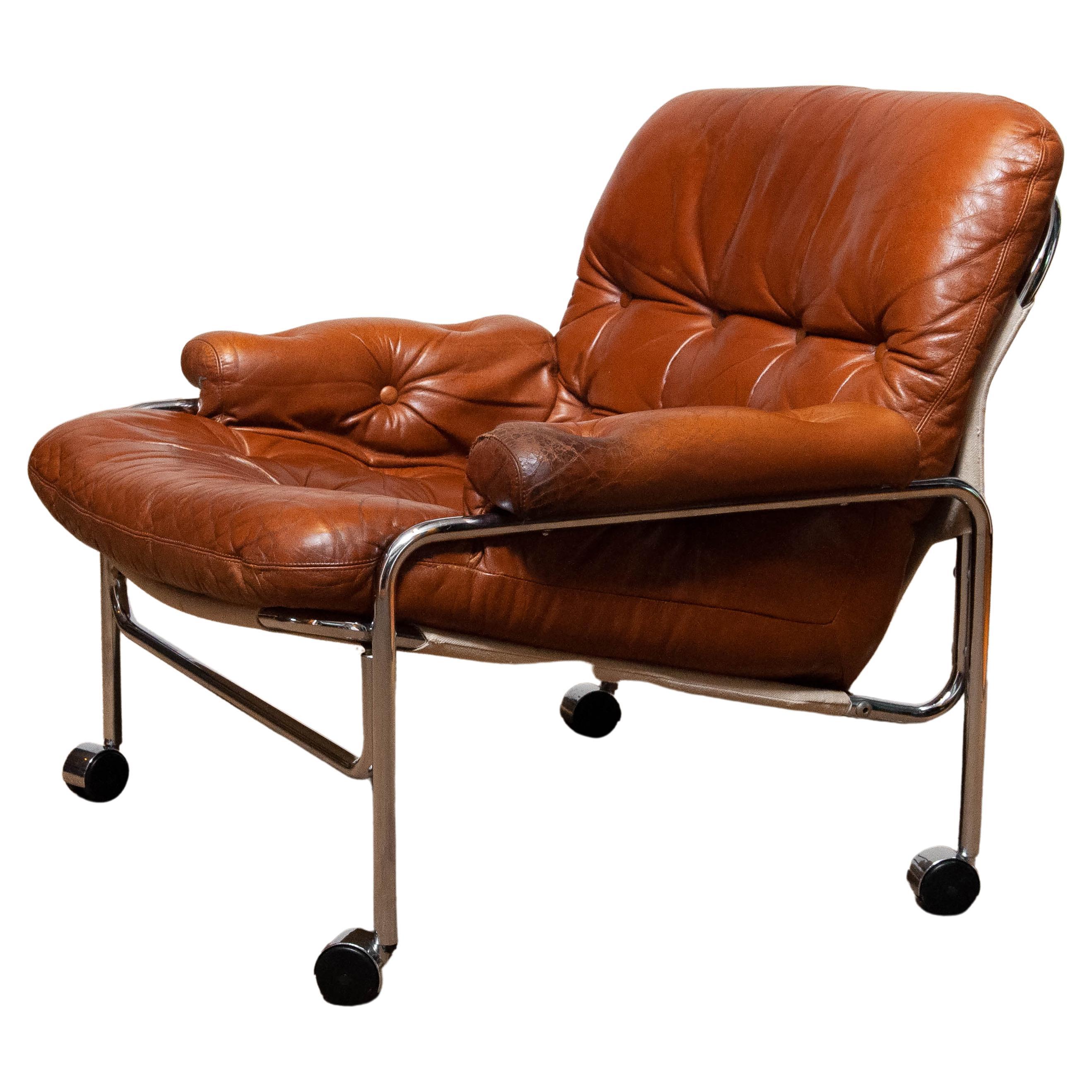 1960s Eva Lounge Chair Chrome and Aged Brown / Tan Leather by Lindlöfs Möbler 