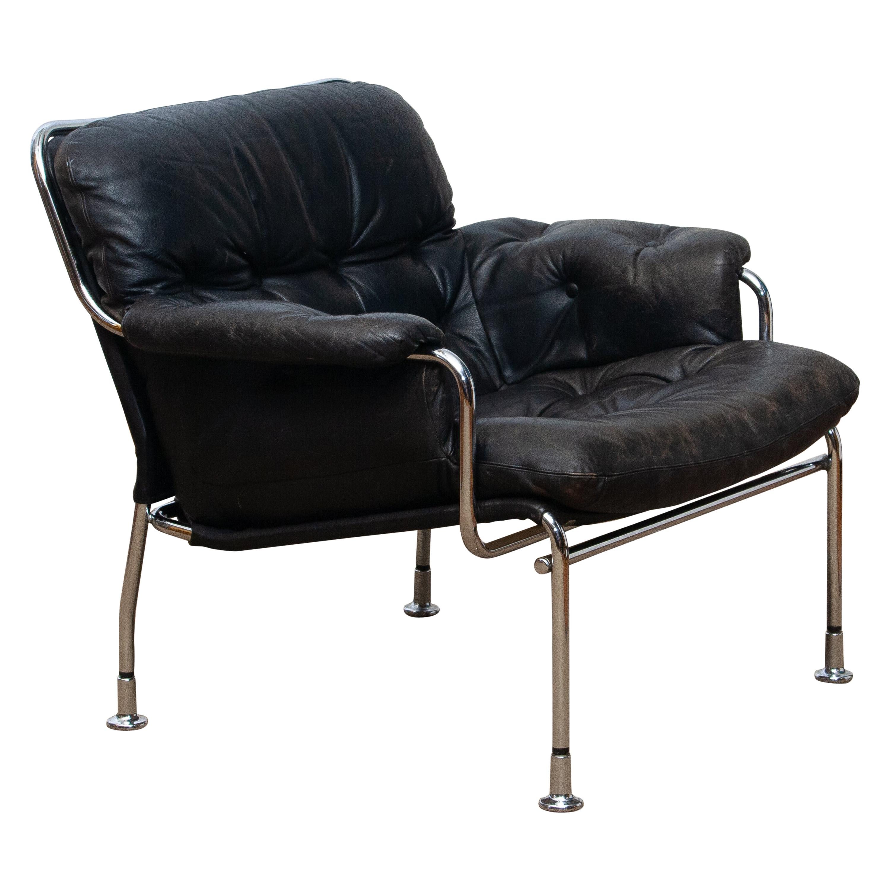 Swedish 1960s, Eva Lounge Chairs in Chrome and Aged Black Leather by Lindlöfs Möbler 1