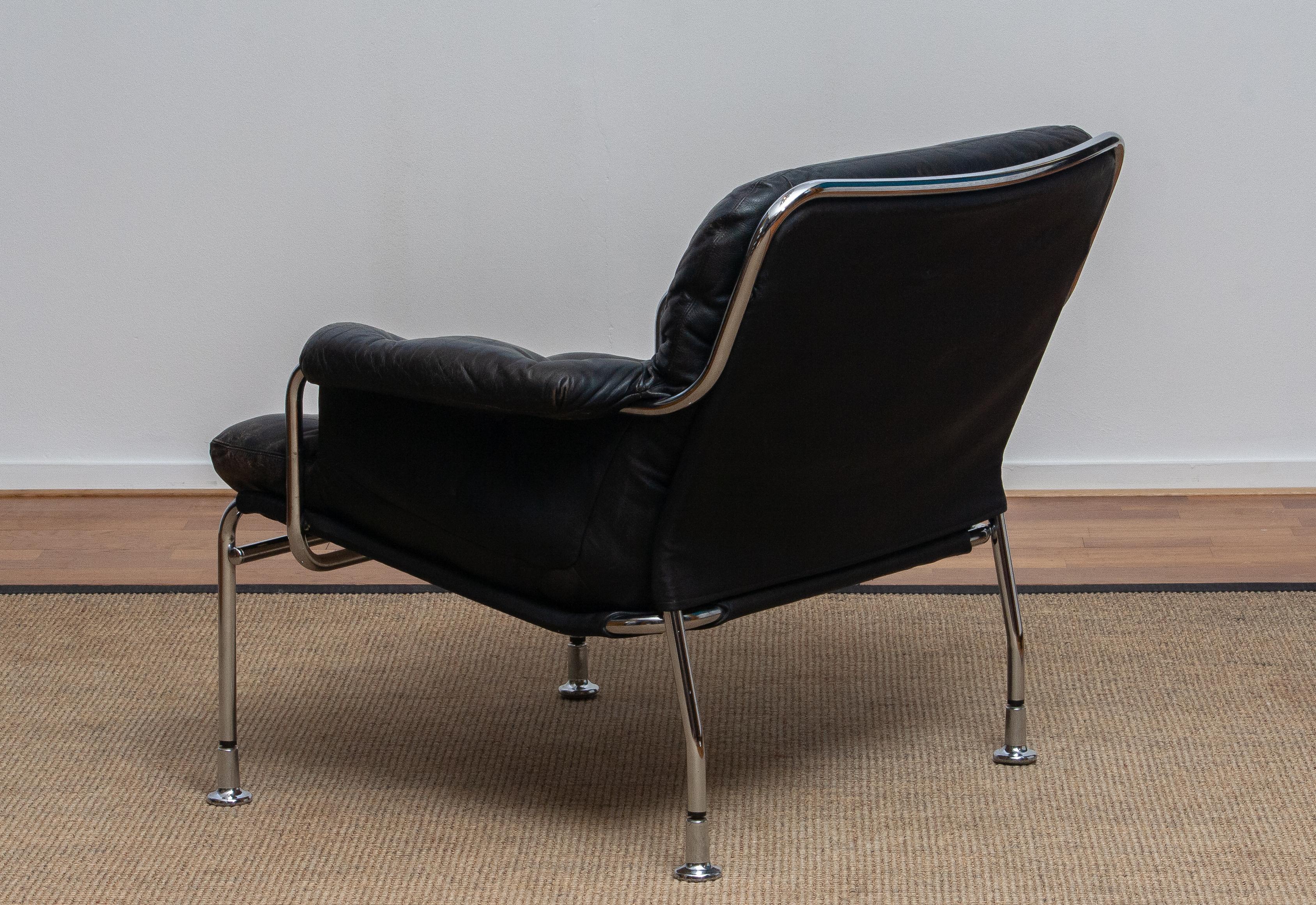 Swedish 1960s, Eva Lounge Chairs in Chrome and Aged Black Leather by Lindlöfs Möbler