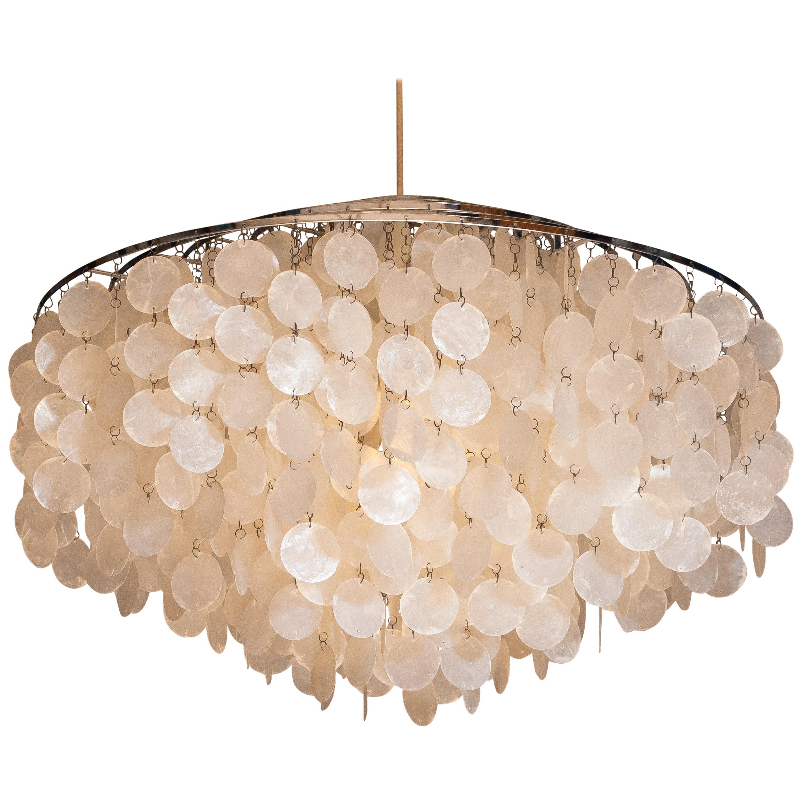 Beautiful and complete original extra large Capiz shell chandelier designed by Verner Panton for J. Luber Ag in Switzerland, 1964.
This extra large chandelier measures a diameter of 70cm. or 27.56