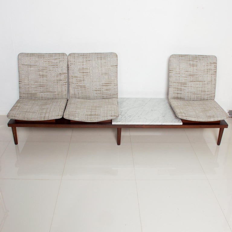 We are offering: Pedro Ramirez Vasquez (acclaimed father of Mexican Modern Architecture) sofa extraordinaire Mexico Modernism, 1960s.
Floating mahogany wood-plywood. New upholstery in light gray pattern. New marble on table. Brass label underneath.