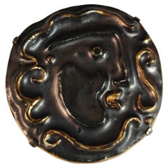 1960s face outline black and gold ceramic brooch