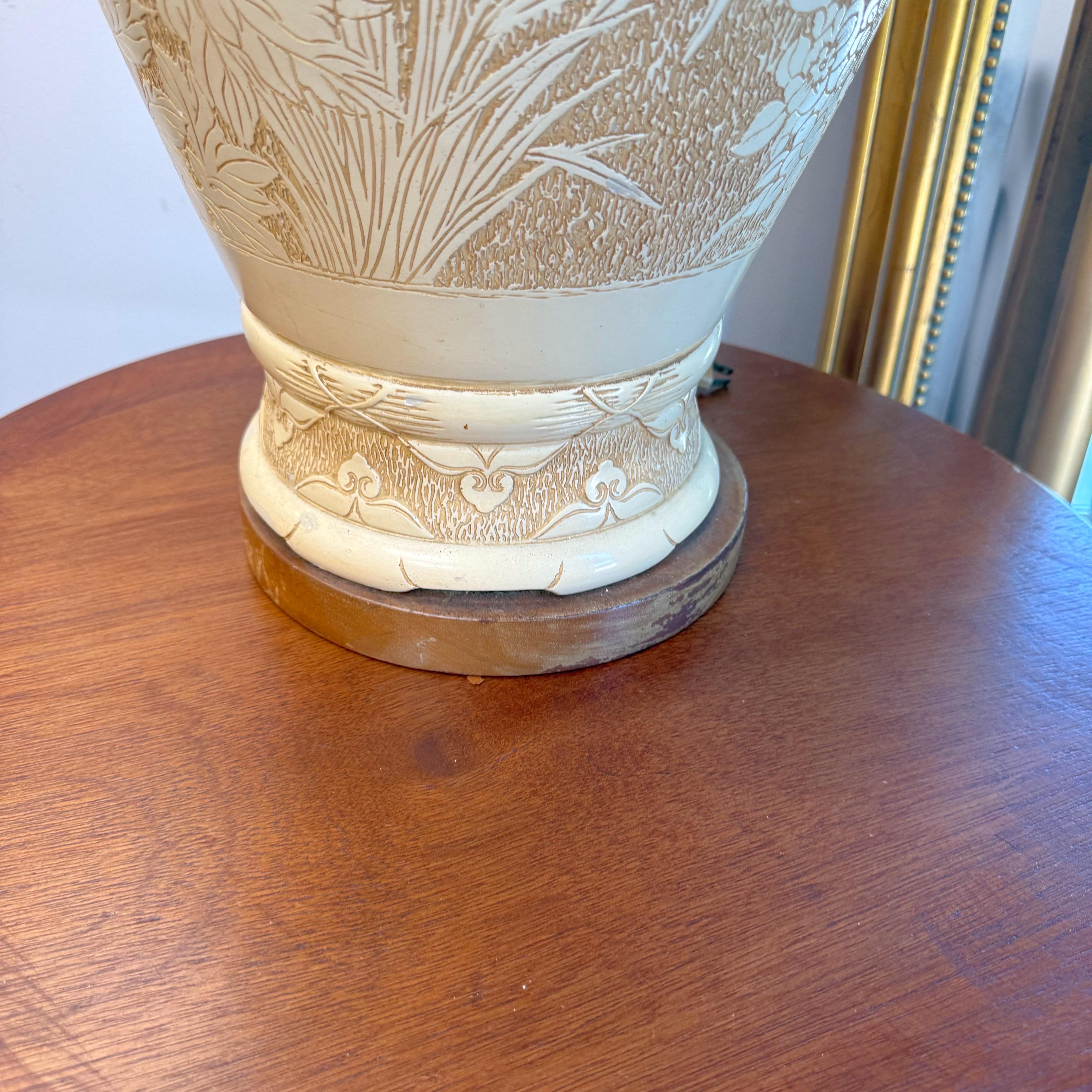 Large statement table lamp chalk ware on a walnut base. Beautiful birds and flowers adorn this gorgeous lamp. We have paired this lamp with a bold Merlot velveteen shade that has silver faux leather accents.  A savory patina enriches the bone