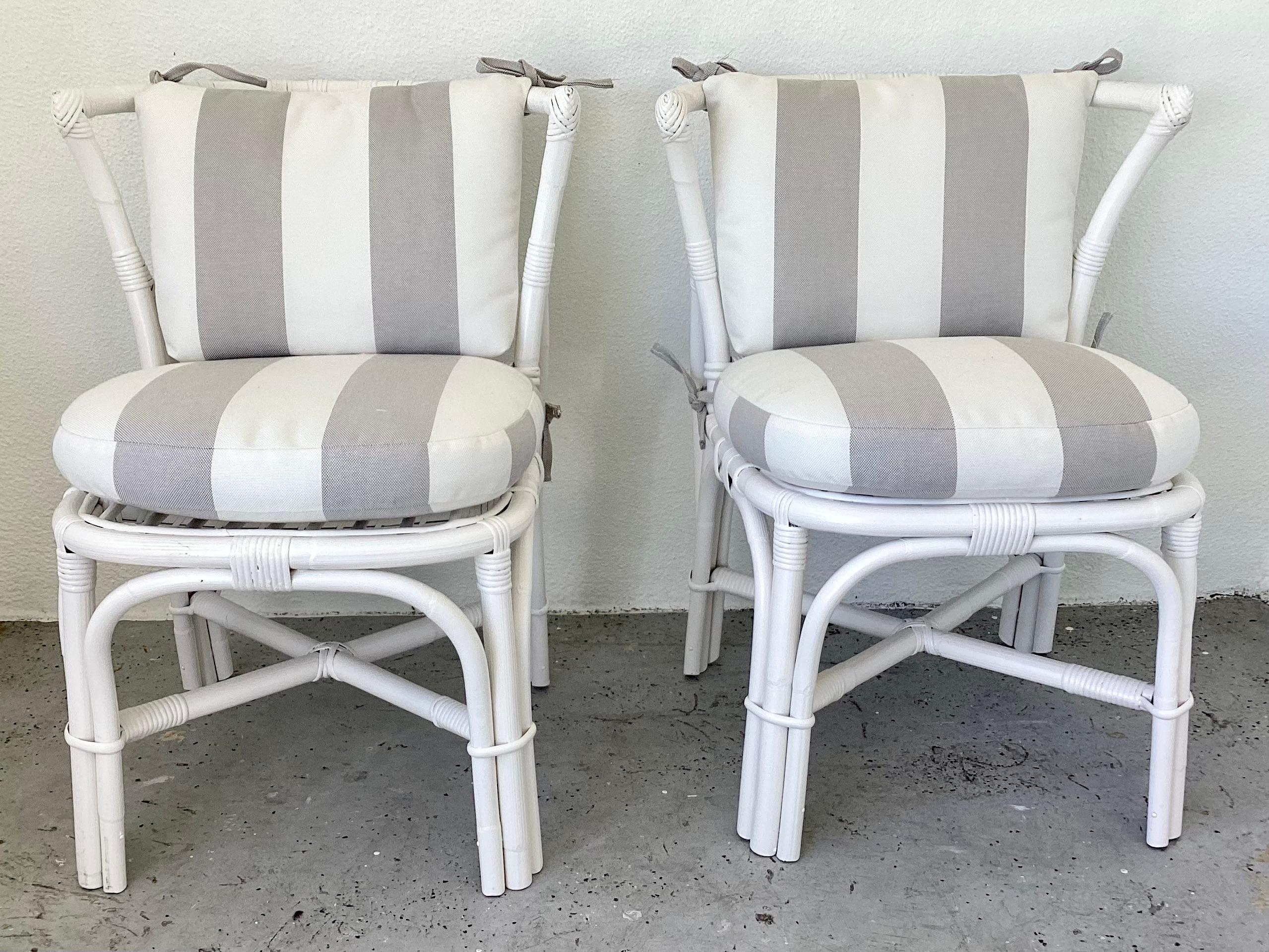 Fabulous pair of Ficks Reed boho chic rattan side chairs with curved backs, new Sunbrella cushions, freshly lacquered in white. Great addition to your boho chic interiors.