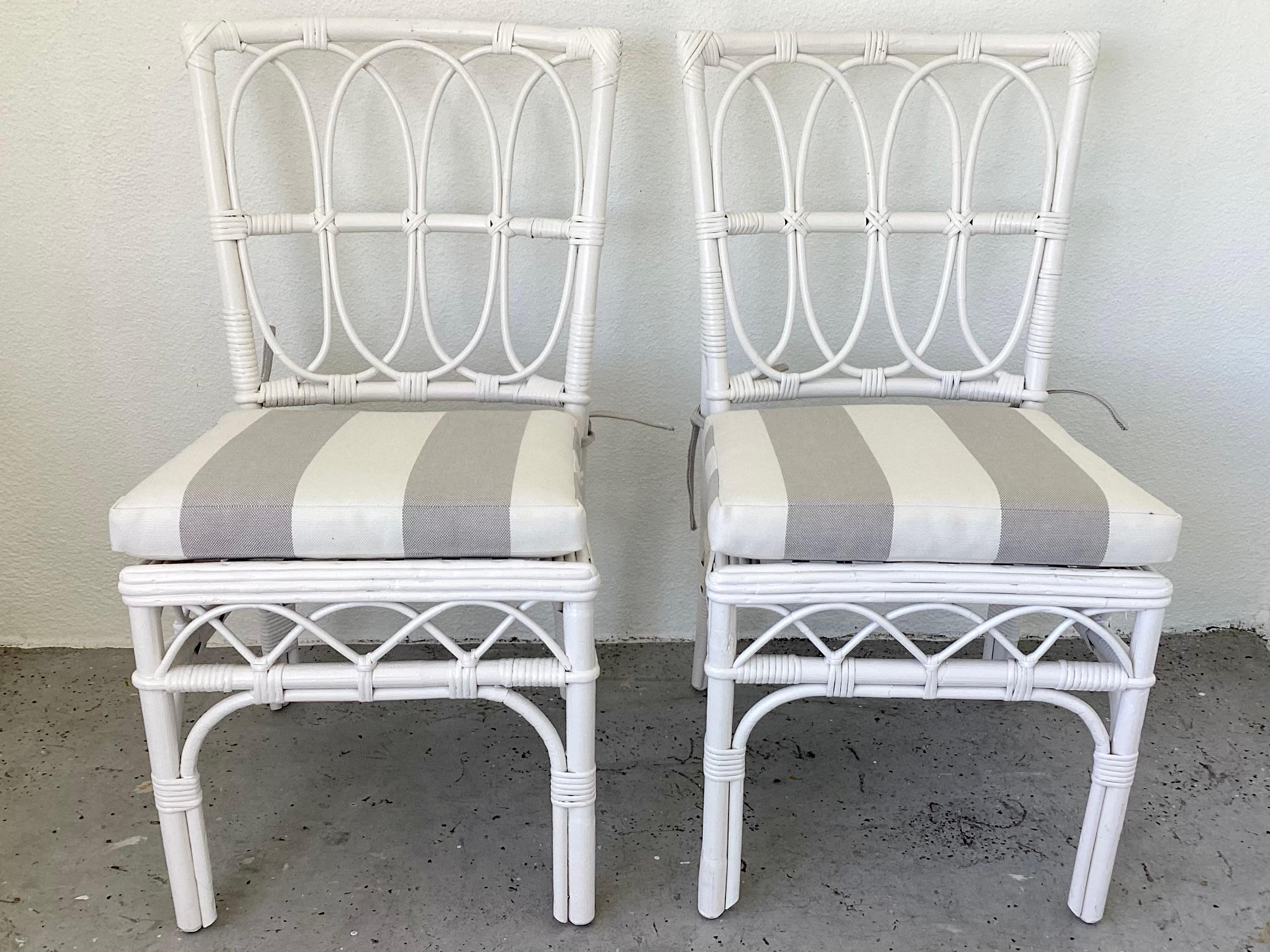 Fabulous pair of Ficks Reed boho chic rattan side chairs with new Sunbrella cushions freshly lacquered in white. Great addition to your boho chic interiors.