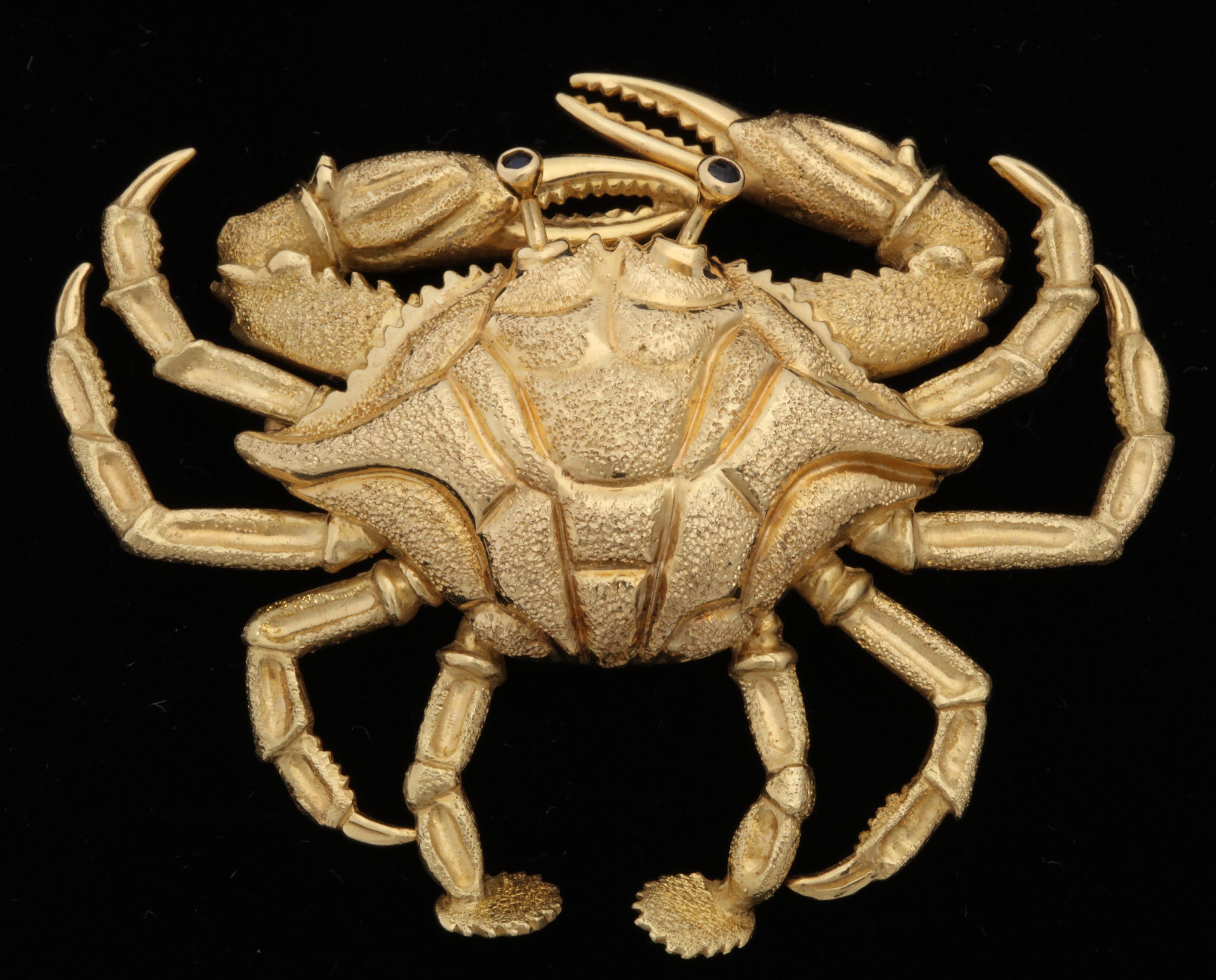 One Large Figural And Adorable Crab Brooch Designed in 18kt Textured Yellow Gold. Eyes Created With Two Faceted Sapphires. Made In The 1960's In The United States Of America.Perfect For The Astrological Sign Of Cancer June 22-July 21.The Perfect