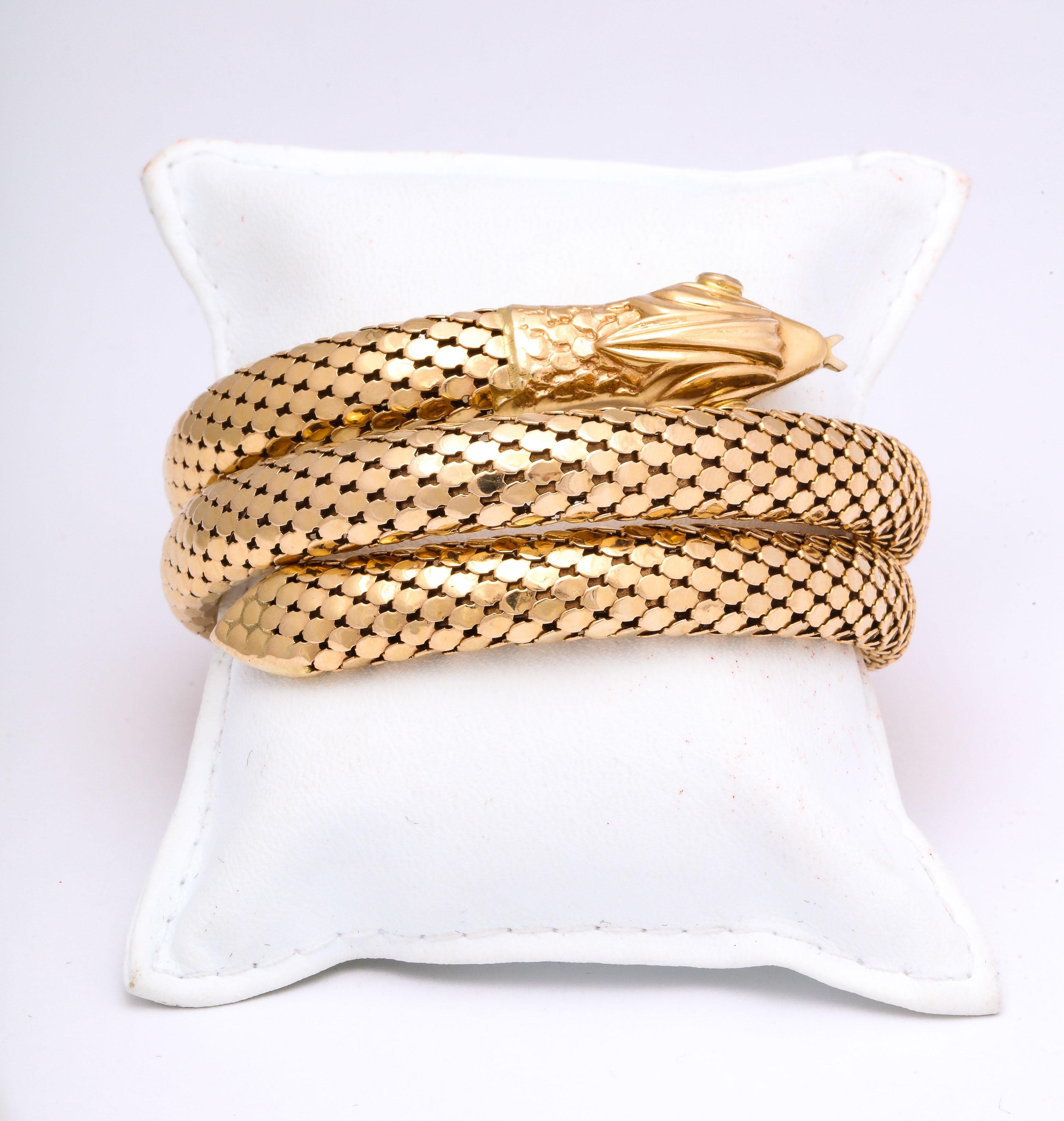 One 18kt Yellow Gold Figural Snake Wrap Around Bracelet With .15ct Diamonds For its Eyes. Created In 1960's In Italy. Fits Standard Wrist Size.Beautiful Textured Snakeskin Pattern For Snakes Body.