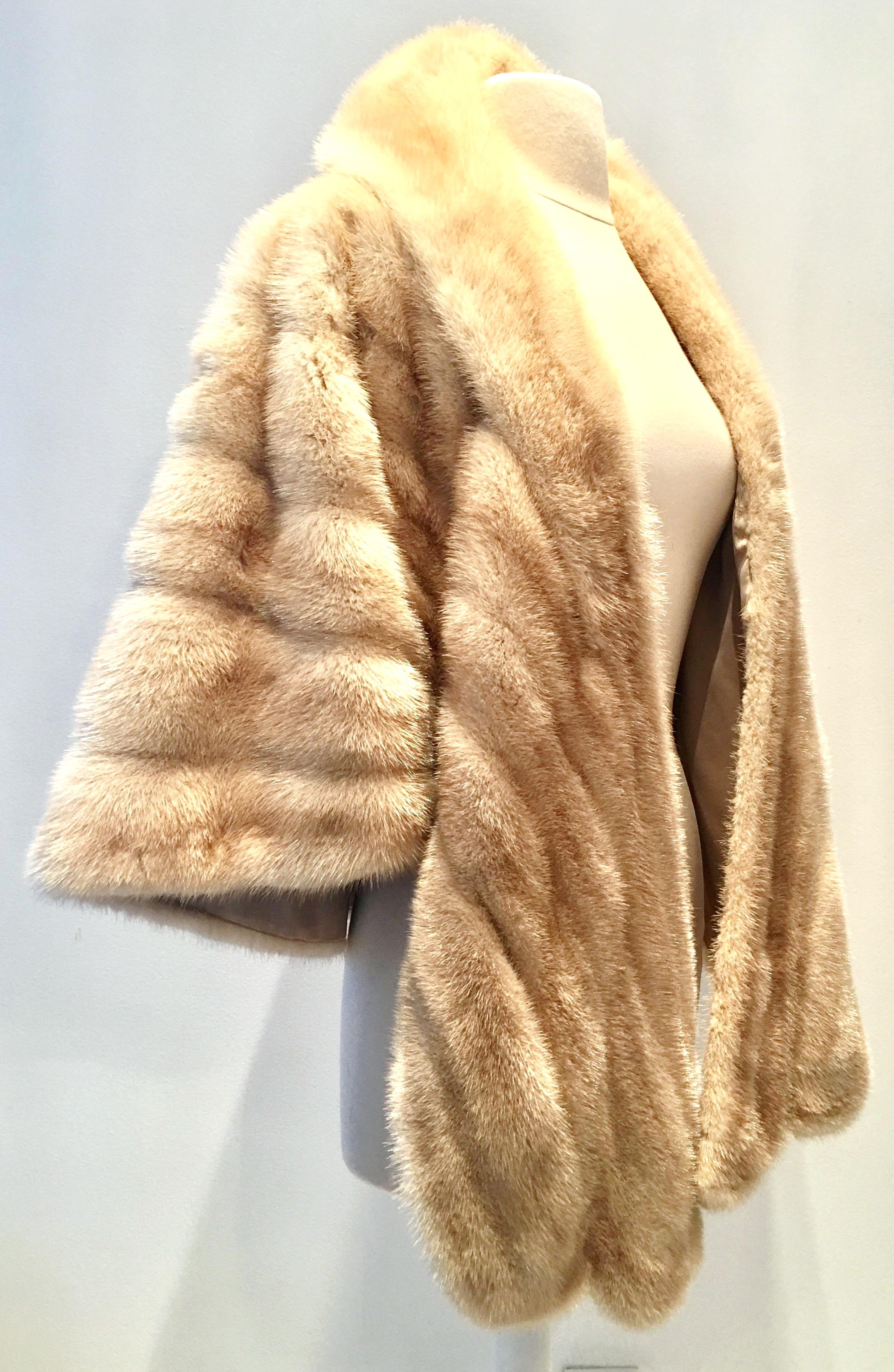 20th Century Exceptional, Rare, Coveted & Pristine, Super Soft, Luxurious & Gorgeous fine blonde pastel mink fur cape with petal detail hem. Features two exterior side pockets and a generous flip collar. Fully lined with no makers mark. One size.
