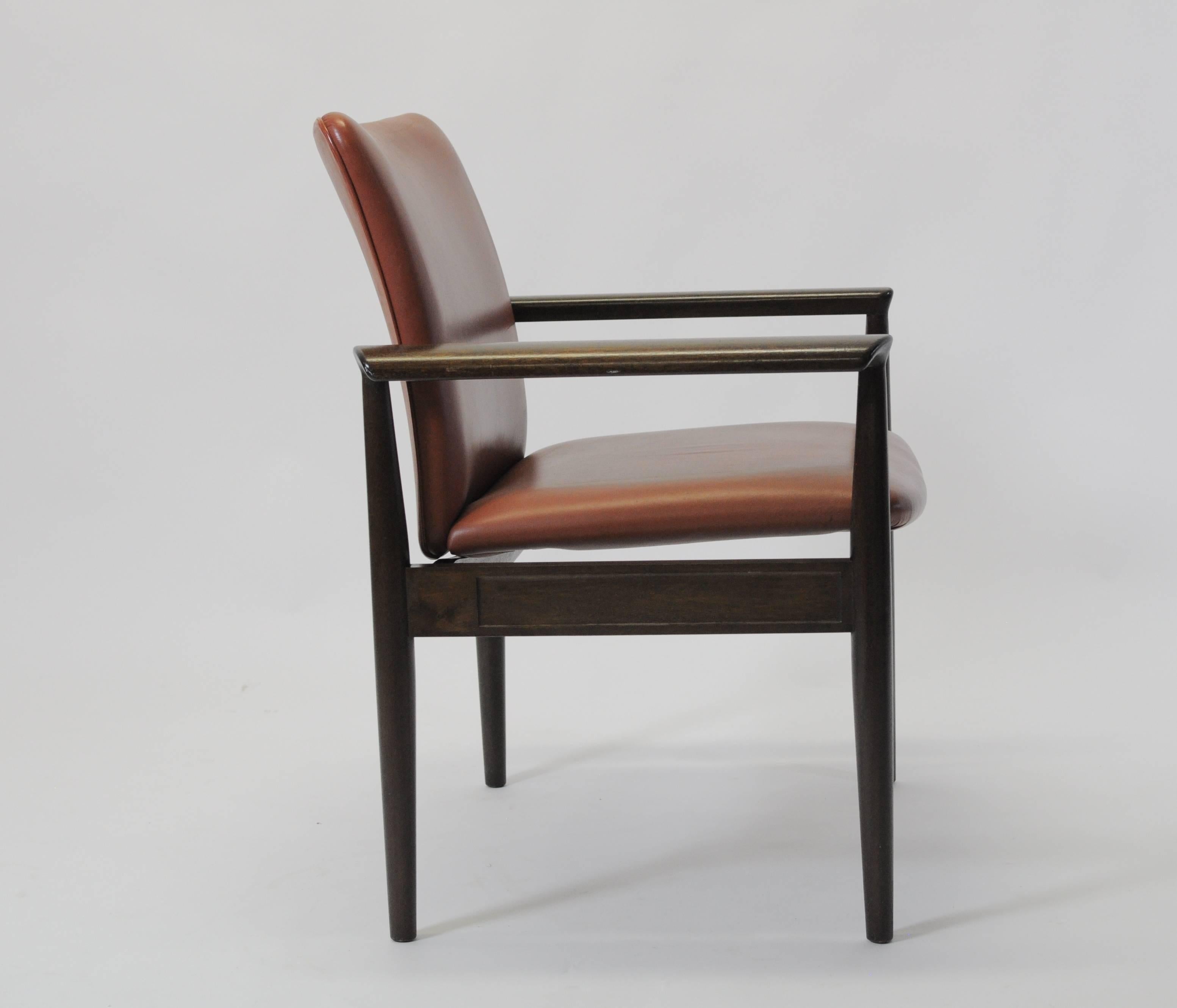 Finn Juhl designed the model 209 chairs in 1961. The model 209 chair is part of a series of furniture named the Diplomat series with chairs, desks, tables, cabinets and other furniture.

The chairs features mahogany frames and brown leather