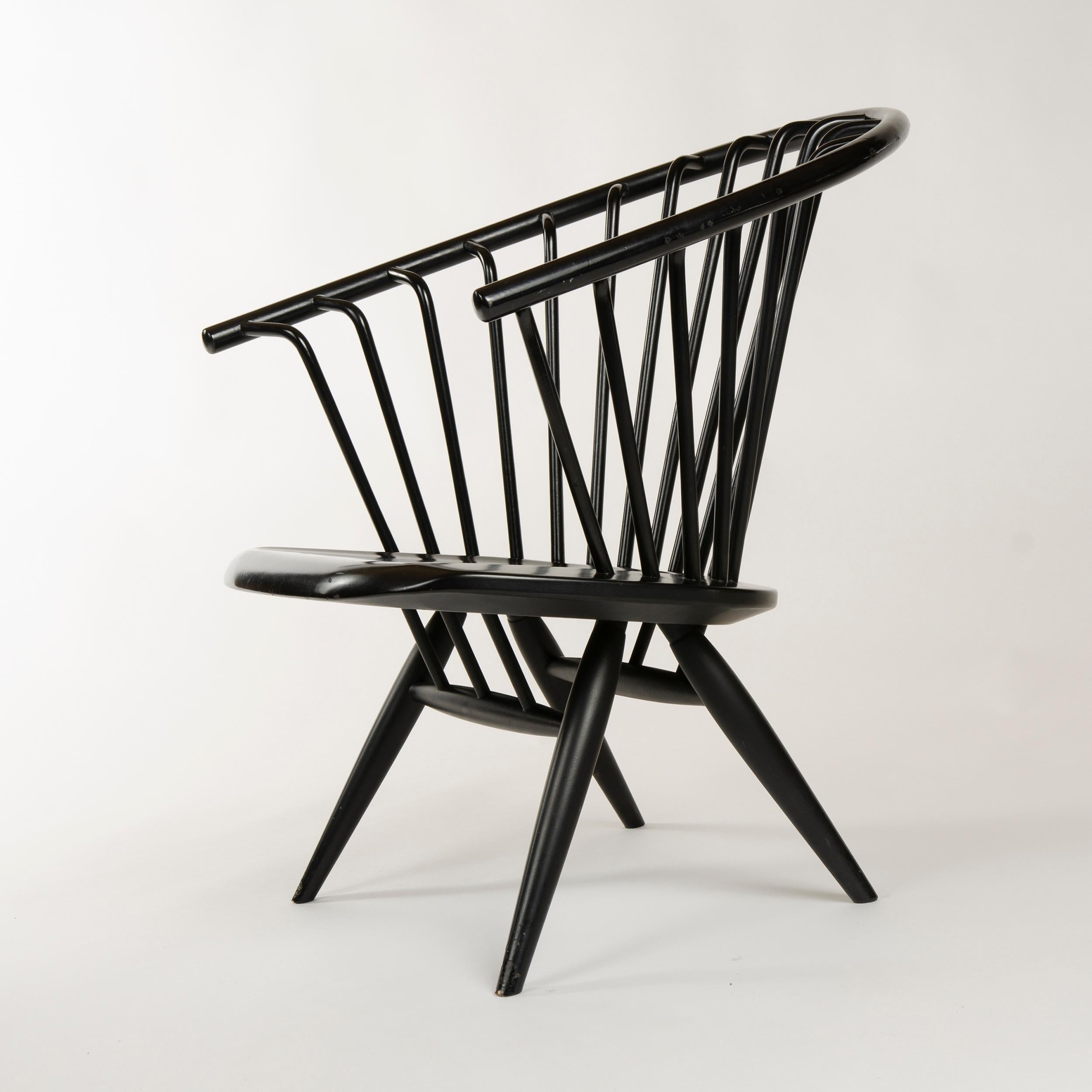 A pair of black painted birch 'Crinolette' lounge chairs with bent wood spokes tenon-joined to the solid bent back rest, maintaining original 'Asko Export' stickers.