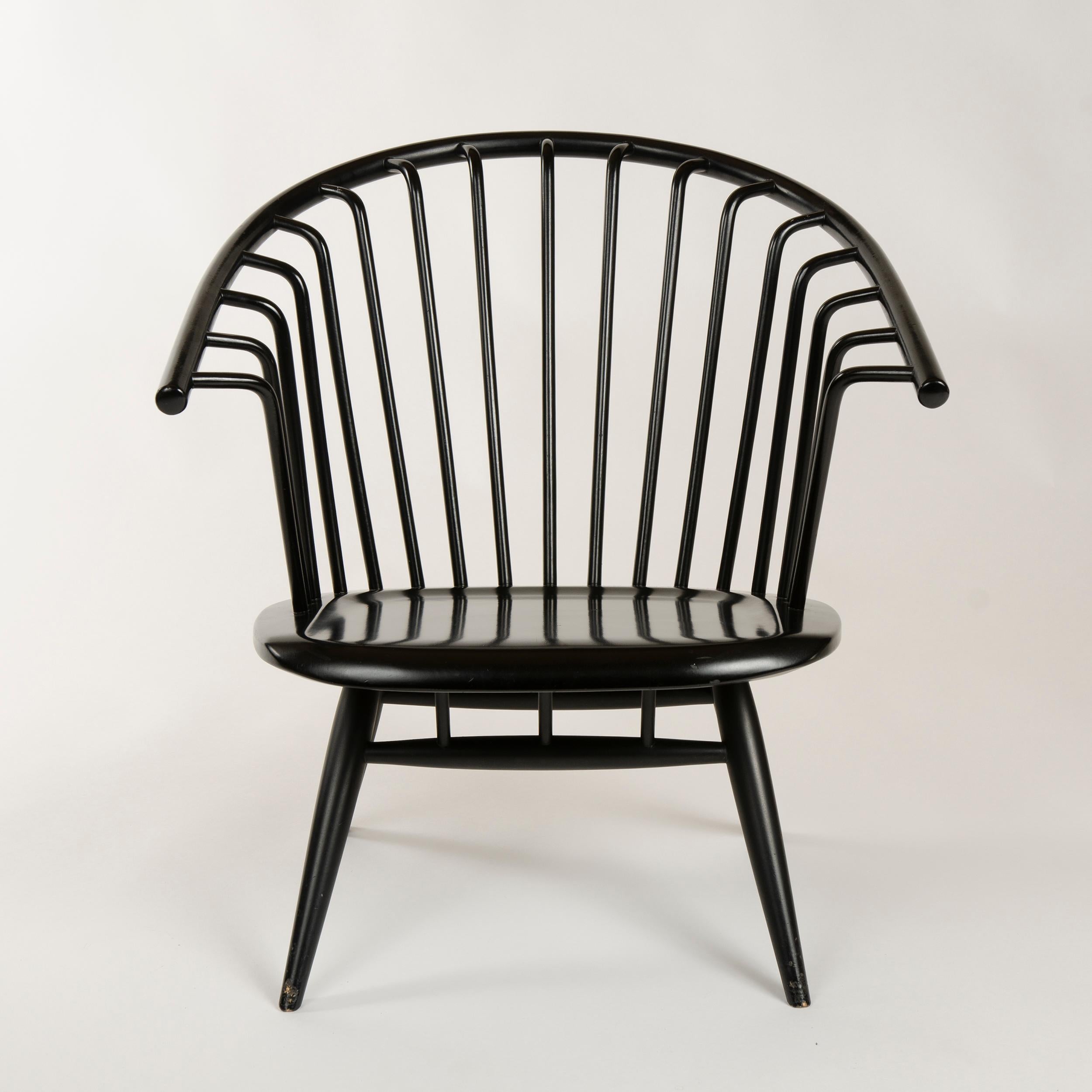 A pair of black painted birch 'Crinolette' lounge chairs with bent wood spokes tenon-joined to the solid bent back rest, maintaining original 'Asko Export' stickers.