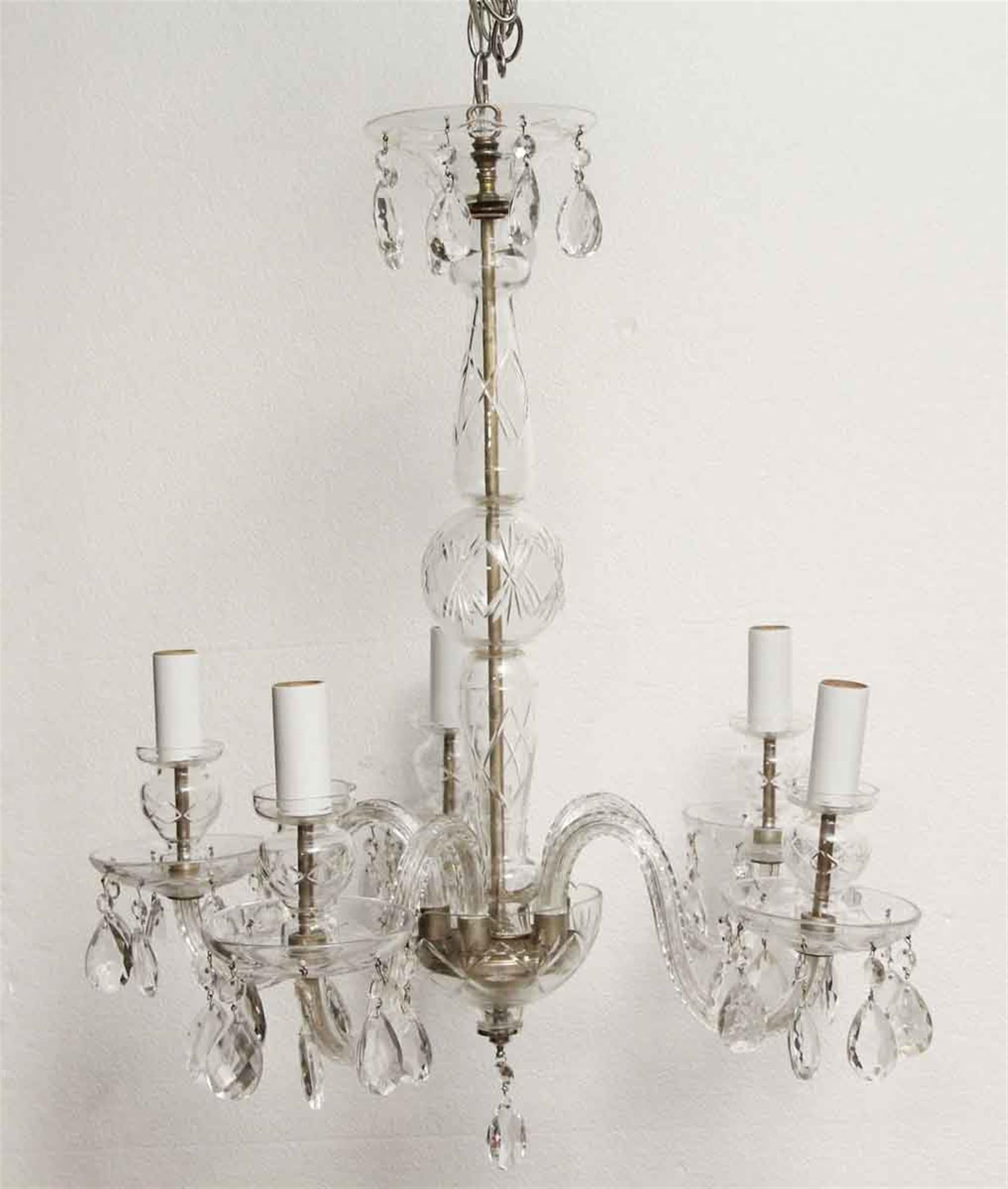 1960s crystal decorative chandelier with five lights. This can be seen at our 1800 South Grand Ave location in Downtown LA.