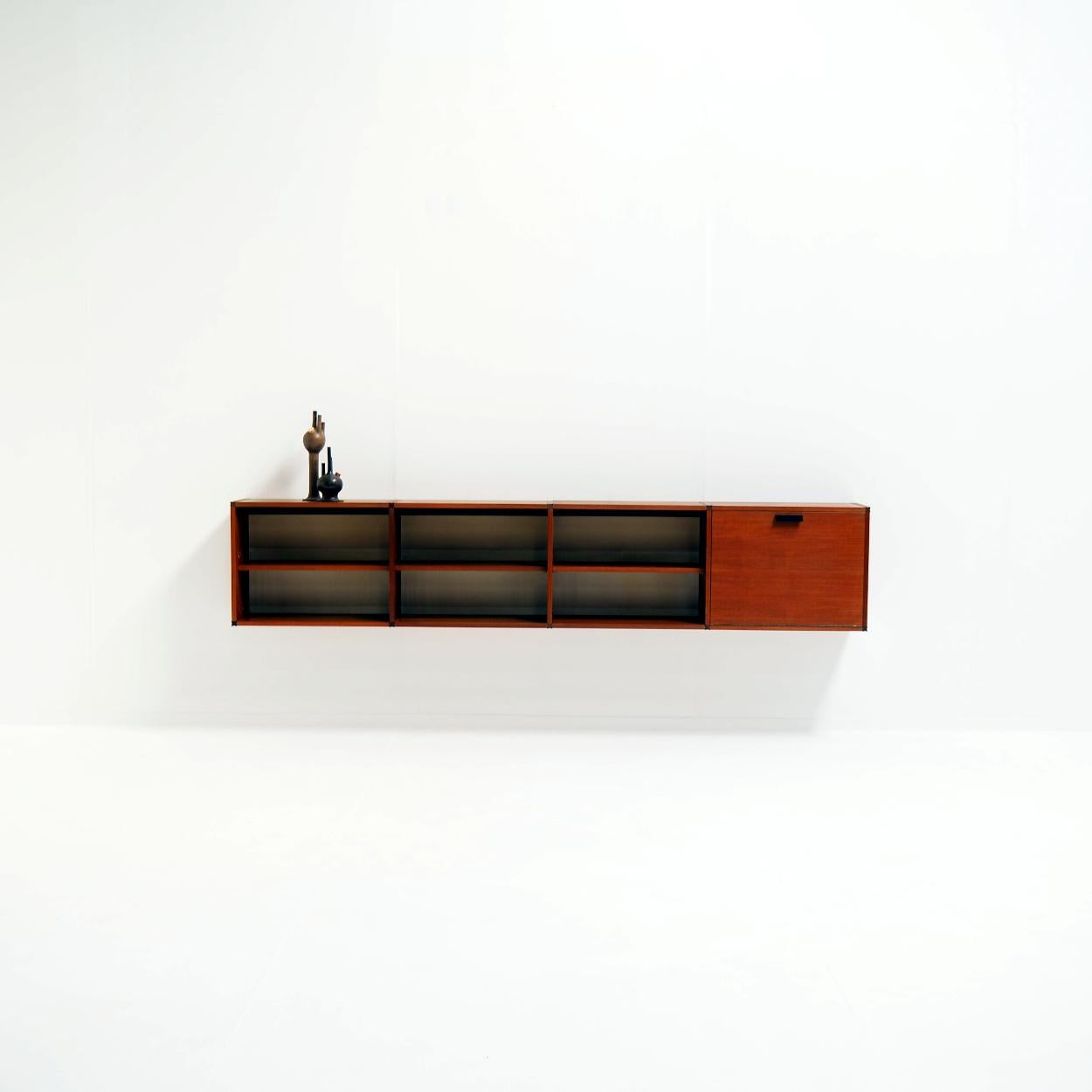 Look at this beautiful example of mid-century modern design.

Whether placed in a living space, dining area, or office, this floating sideboard designed by Cees Braakman for Pastoe offers both functionality and elegance. And its wall-mounted design