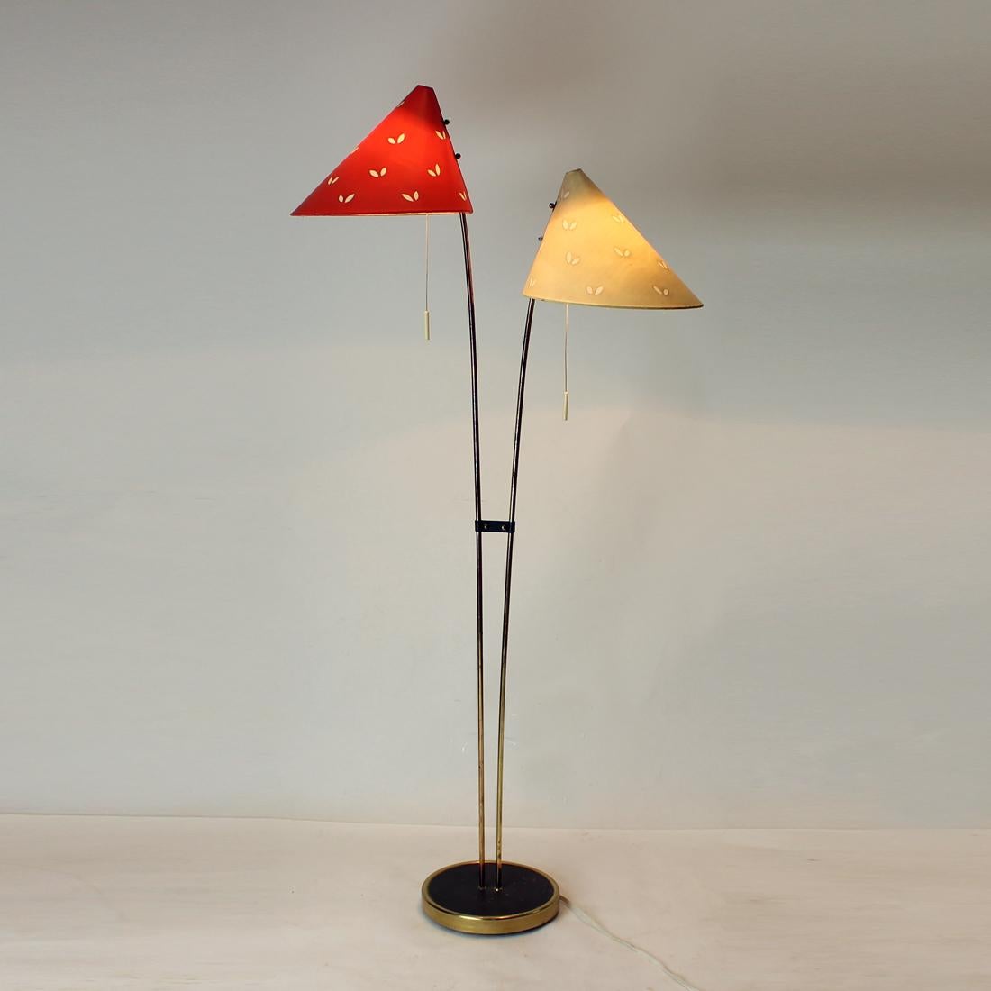 Amazing floor lamp in a great condition! This lamp was produced in Czechoslovakia in 1960s by Zukov. Stands on a strong brass construction and rods. The brass shows only minor age fading. the lamp has two original shields in red and cream shade of