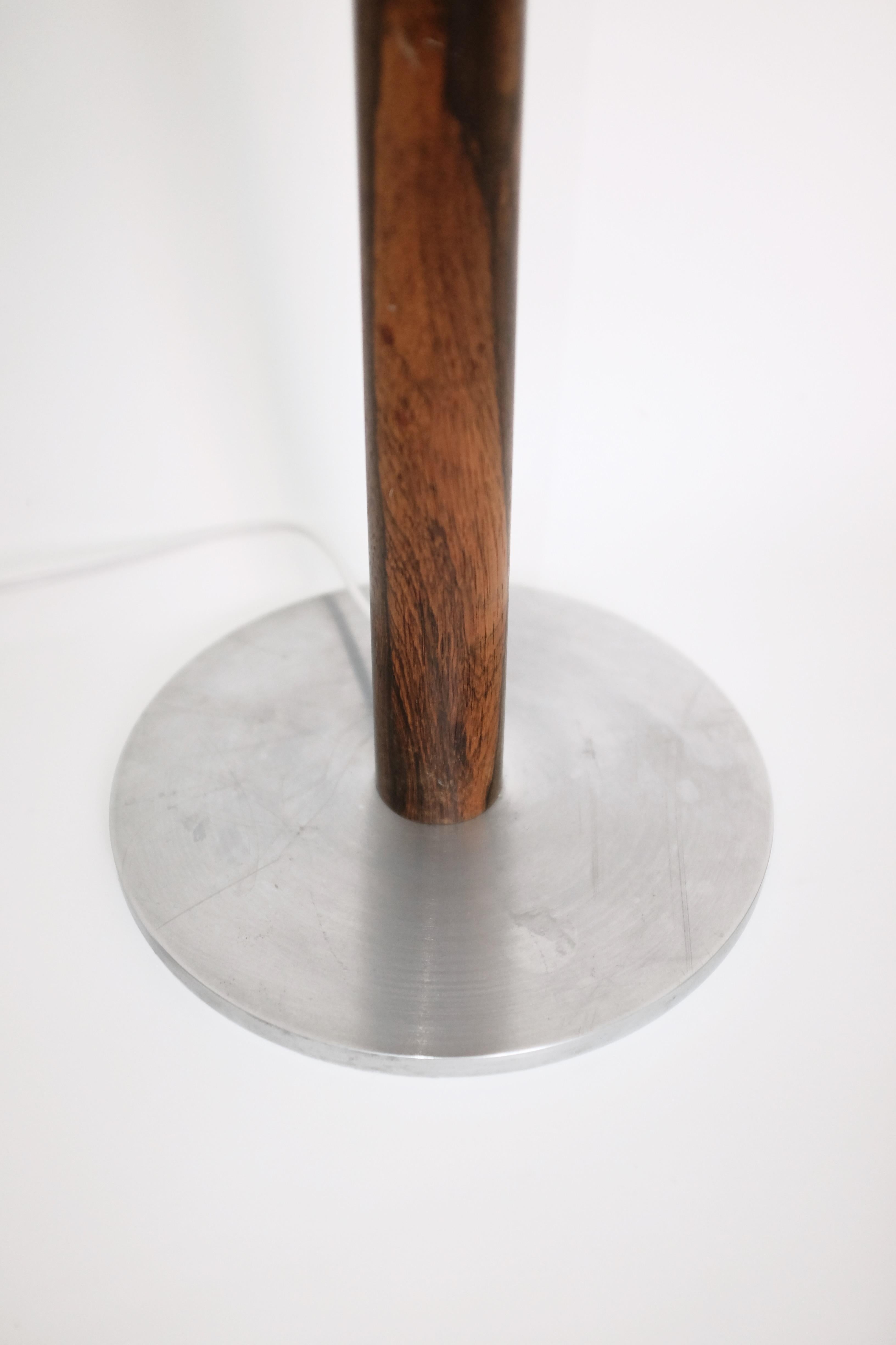 Stunning 1960's floorlamp by Uno & Östen Kristiansson for Luxus, Sweden. Made of a brushed steel base and wooden arm with a new black linen lampshade. Makers label still attached. Overall in a very good condition with age appropriate wear to the