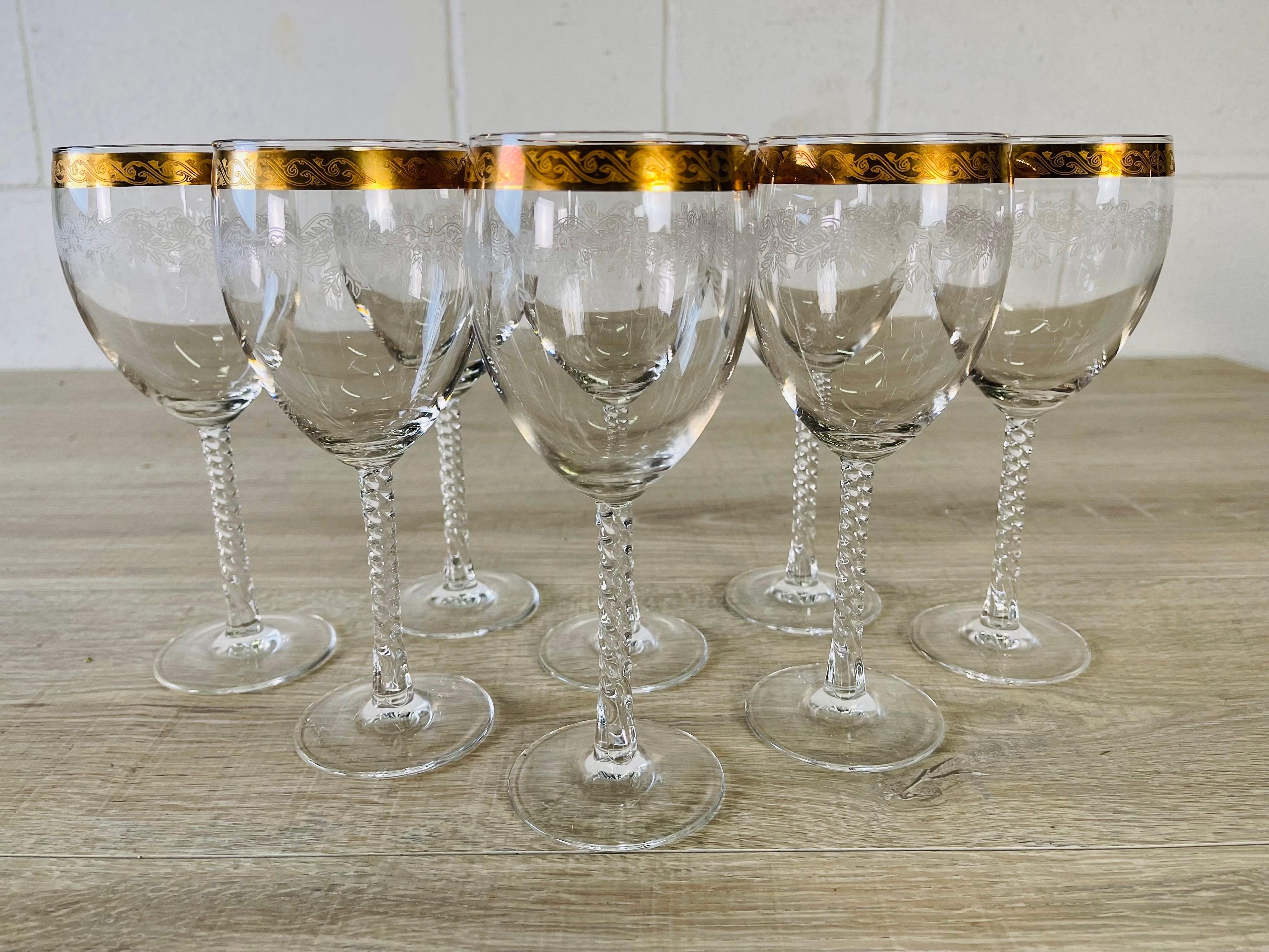 Vintage 1960s set of 8 tall gold floral rimmed wine goblets with twisted stems. No marks.