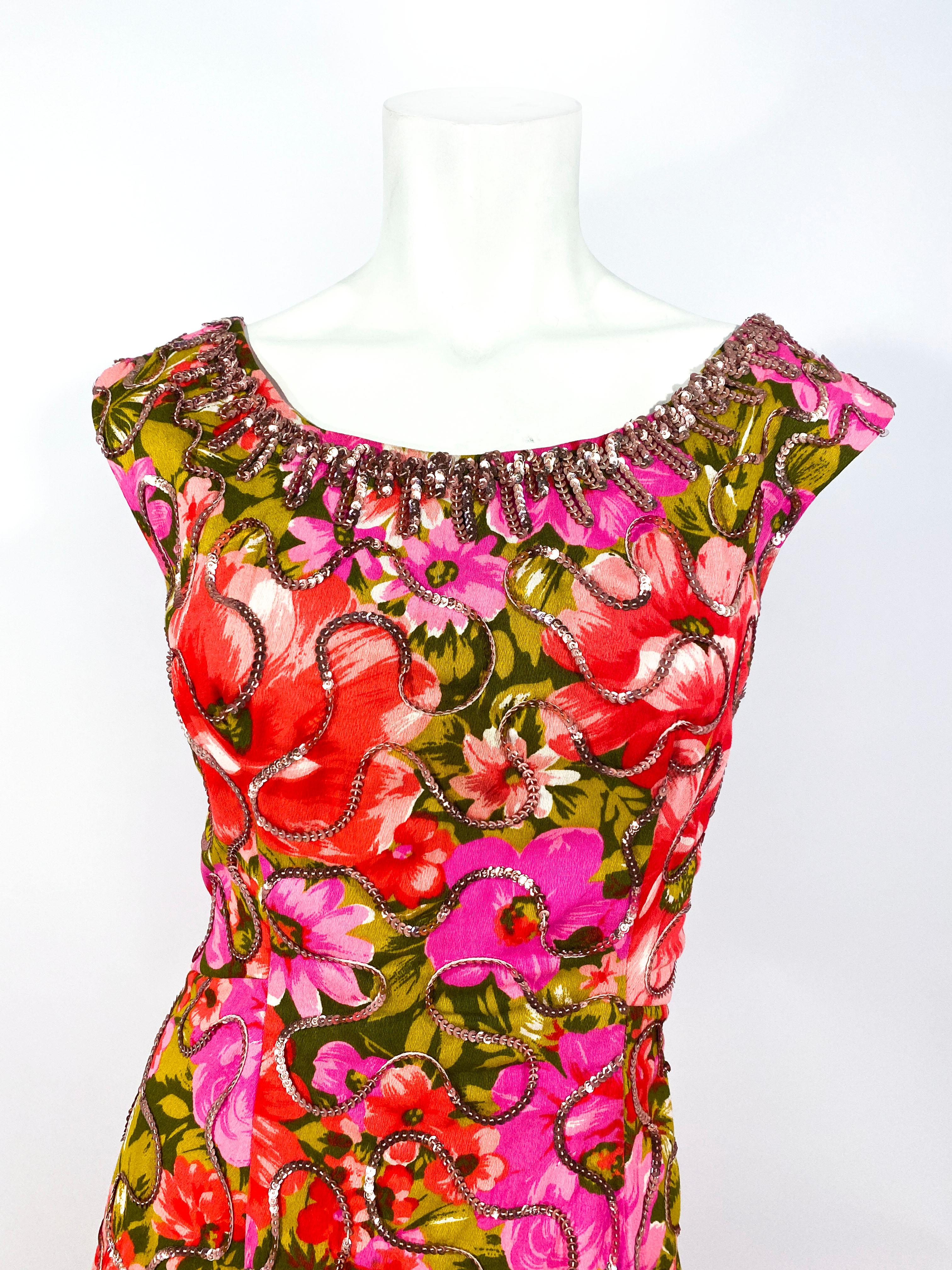 1960s custom full-length summer evening gown featuring a vibrant floral print with rose pink sequin accents thought out the entire dress and densely sequined along the neckline. 