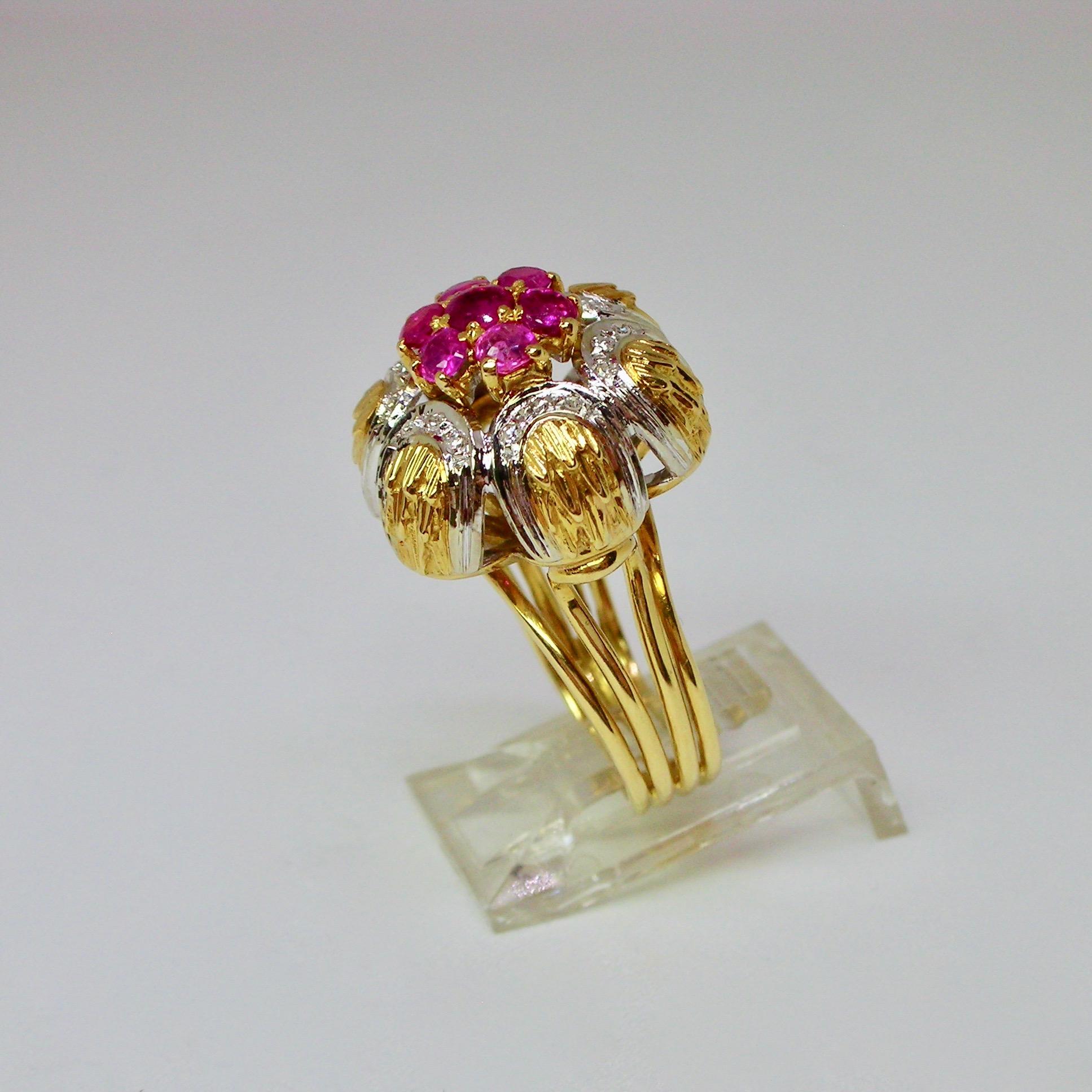 Floral cocktail ring set in 18ct two tone gold with natural rubies of around 0.50ct total and small contouring diamonds, 1960s period circa stamped ITALY. 