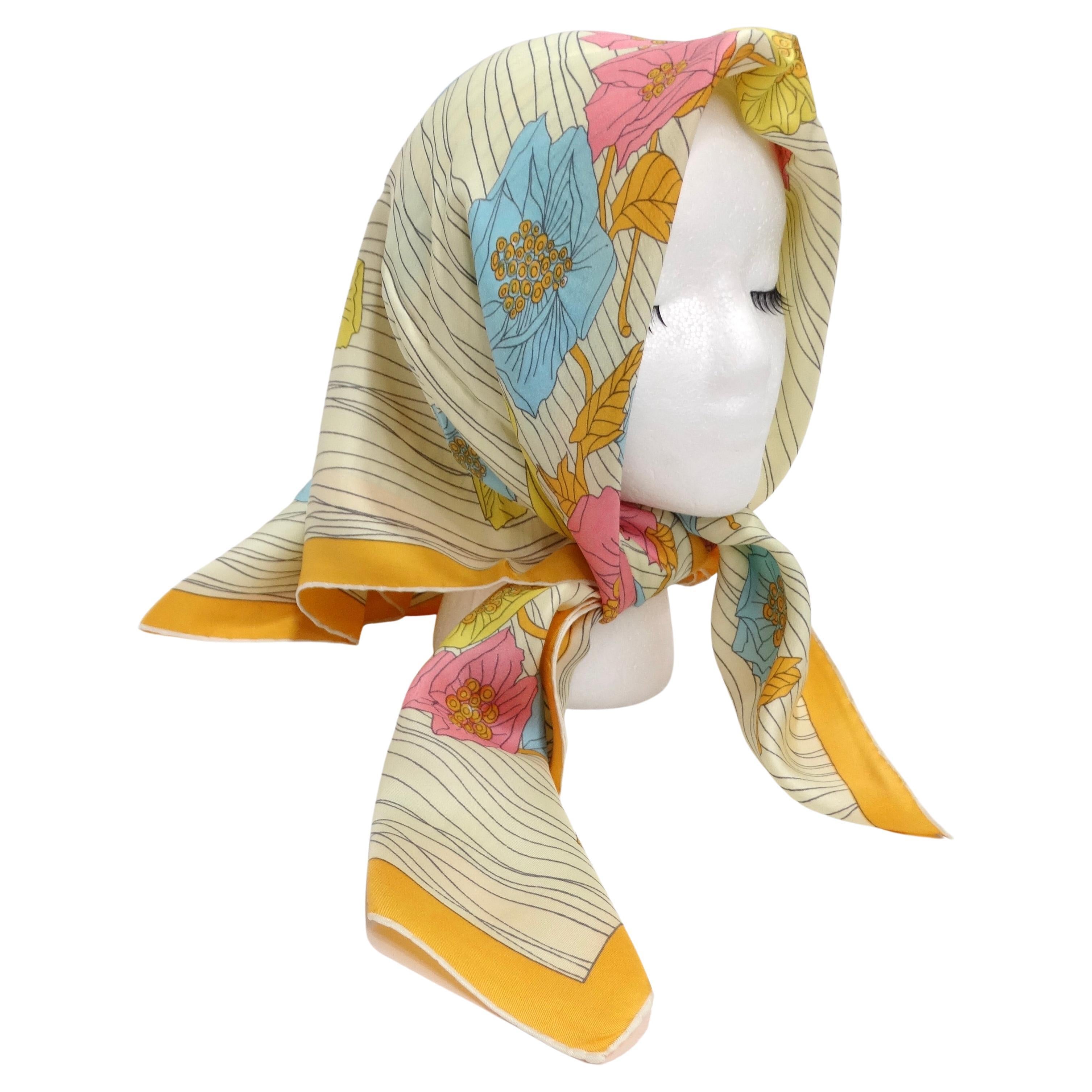 Introducing a timeless piece of artistry: the 1960s Floral Silk Scarf. This exquisite accessory captures the essence of vintage charm while offering endless possibilities for contemporary styling. Warm and vibrant shades merge to form intricate