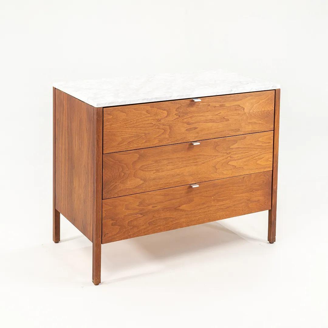 This is a Florence Knoll Walnut 3-drawer dresser, designed by Florence Knoll in 1960 for Knoll International. The listed price includes one dresser and we have two available for purchase. These examples date to the 1960s. The chests feature