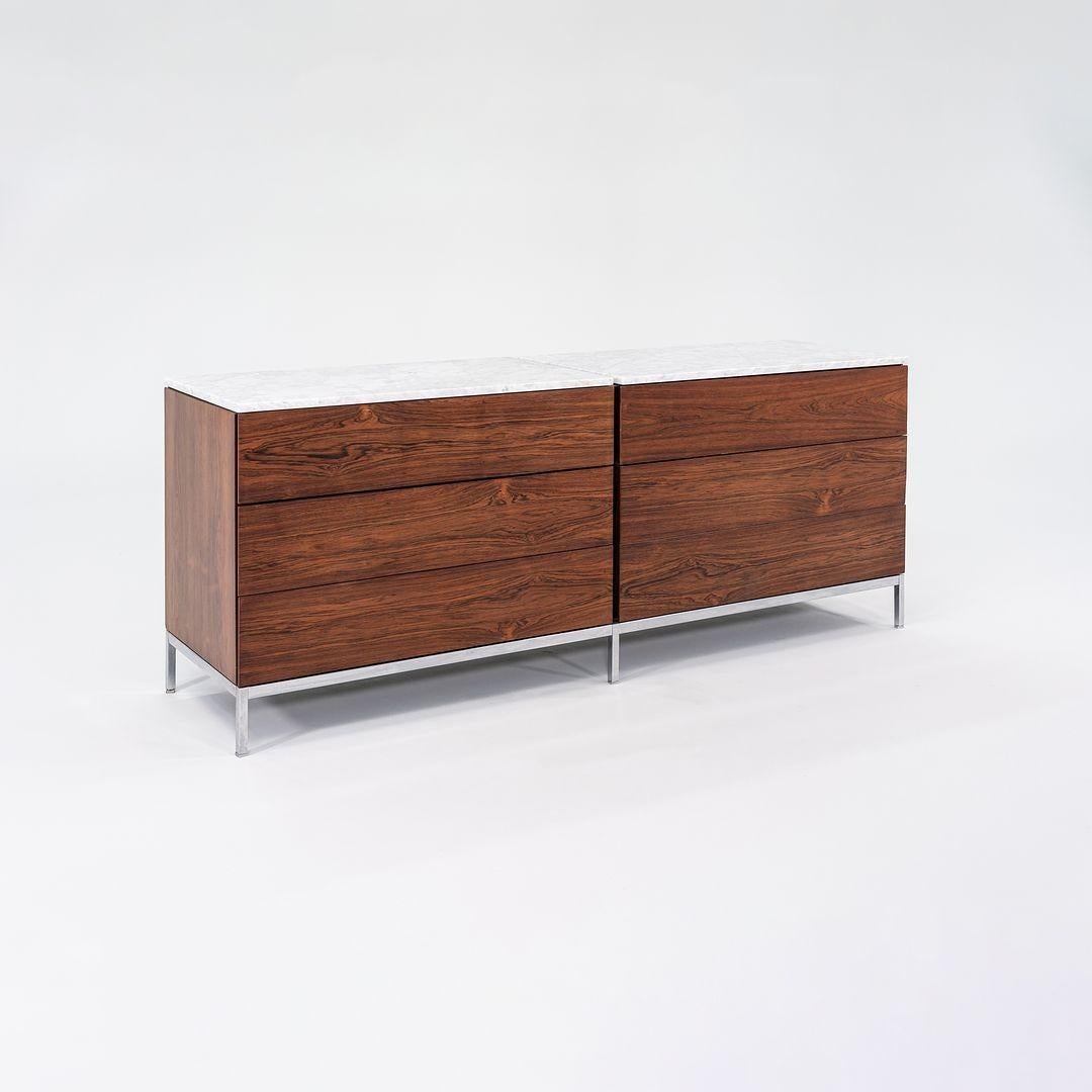 This is a Double Dresser, designed by Florence Knoll for Knoll International in 1958. This example dates to the 1960s and features a rich Brazilian Rosewood Veneer. The wooden case sports six wide drawers and sits atop a chromed-steel base with