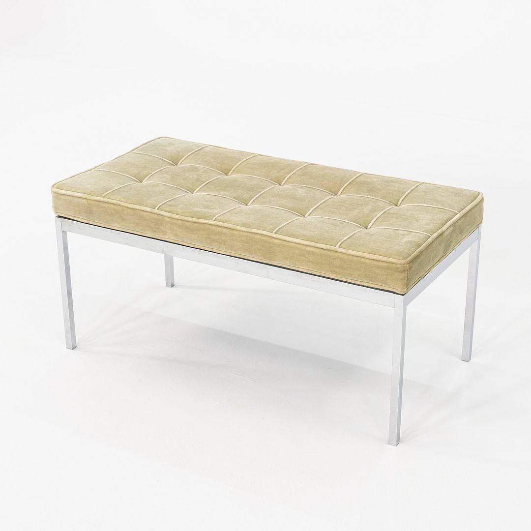 This is a Florence Knoll Bench, designed for Knoll in 1954. This particular example dates to the 1960s. The design incorporates a simple chromed steel frame with a padded seat that is upholstered in green mohair. It has a geometric profile, a la