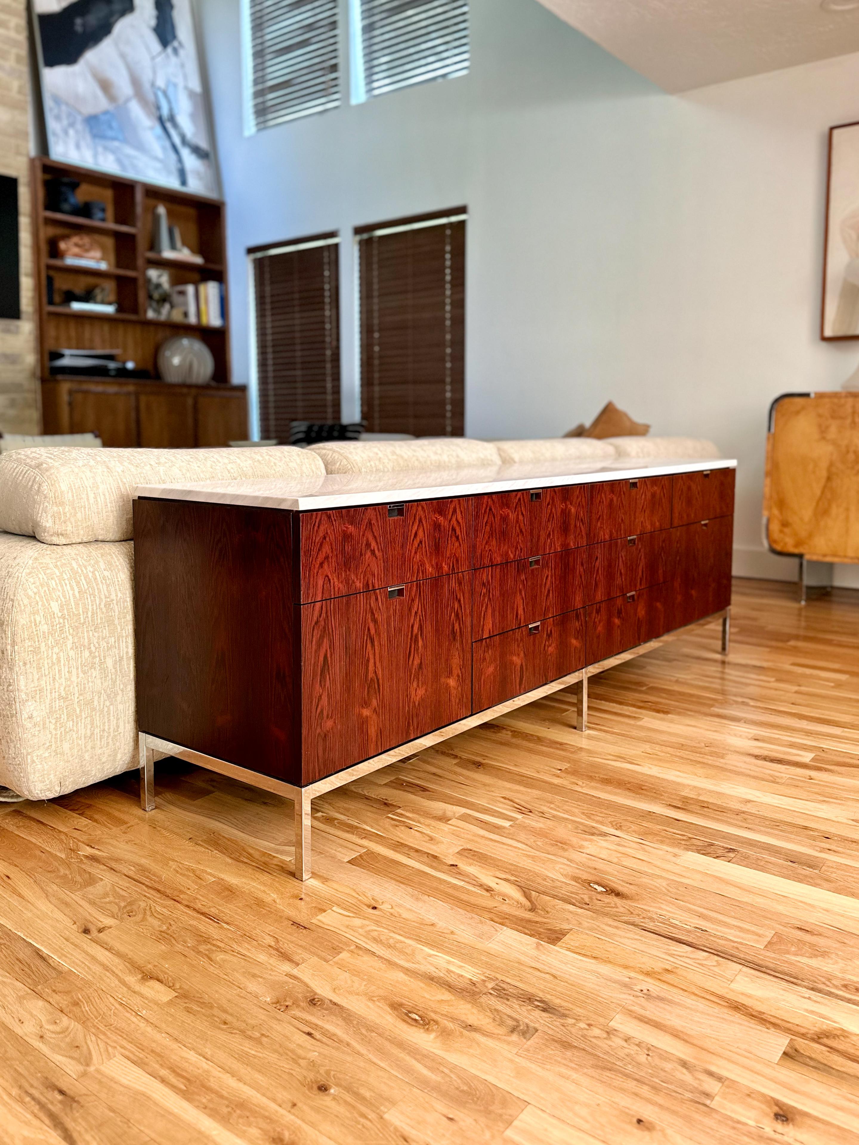 Stunning Florence Knoll marble-top rosewood credenza, c.1960s. Polished chrome base, rosewood veneer, and Olympus Calacatta marble top make this piece drop dead gorgeous, while the 4-position configuration with 8 drawers and 2 filing drawers