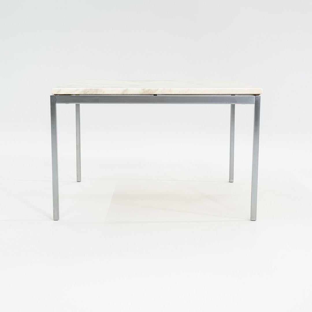 This is a Florence Knoll Medium Side Table, originally designed by Florence Knoll in 1954. This particular example was produced by Knoll in the USA in the 1960s. The table's design is comprised of a steel frame and marble tabletop. 

The table