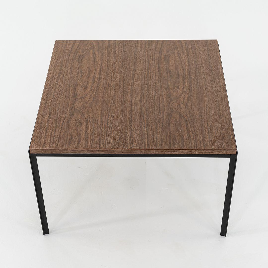 This is a Florence Knoll Square Coffee Table, originally designed by Florence Knoll in 1954. This particular example was produced by Knoll in the USA in the 1960s. The table is comprised of a steel frame with a wood veneer tabletop. 

The table