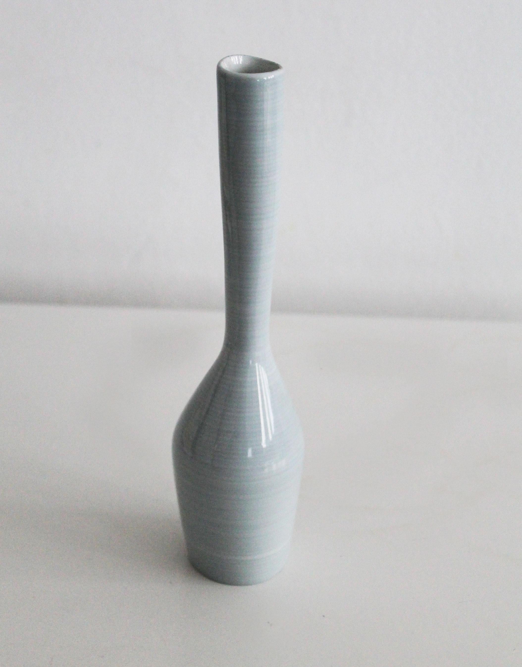 This is an original and quite rare flower vase model 541 was designed by Czech sculptor Jindrich Marek and produced in the 1960’s by renowned Royal Dux Bohemia in former Czechoslovakia.

Jindrich Marek’s work is perhaps not as well known and
