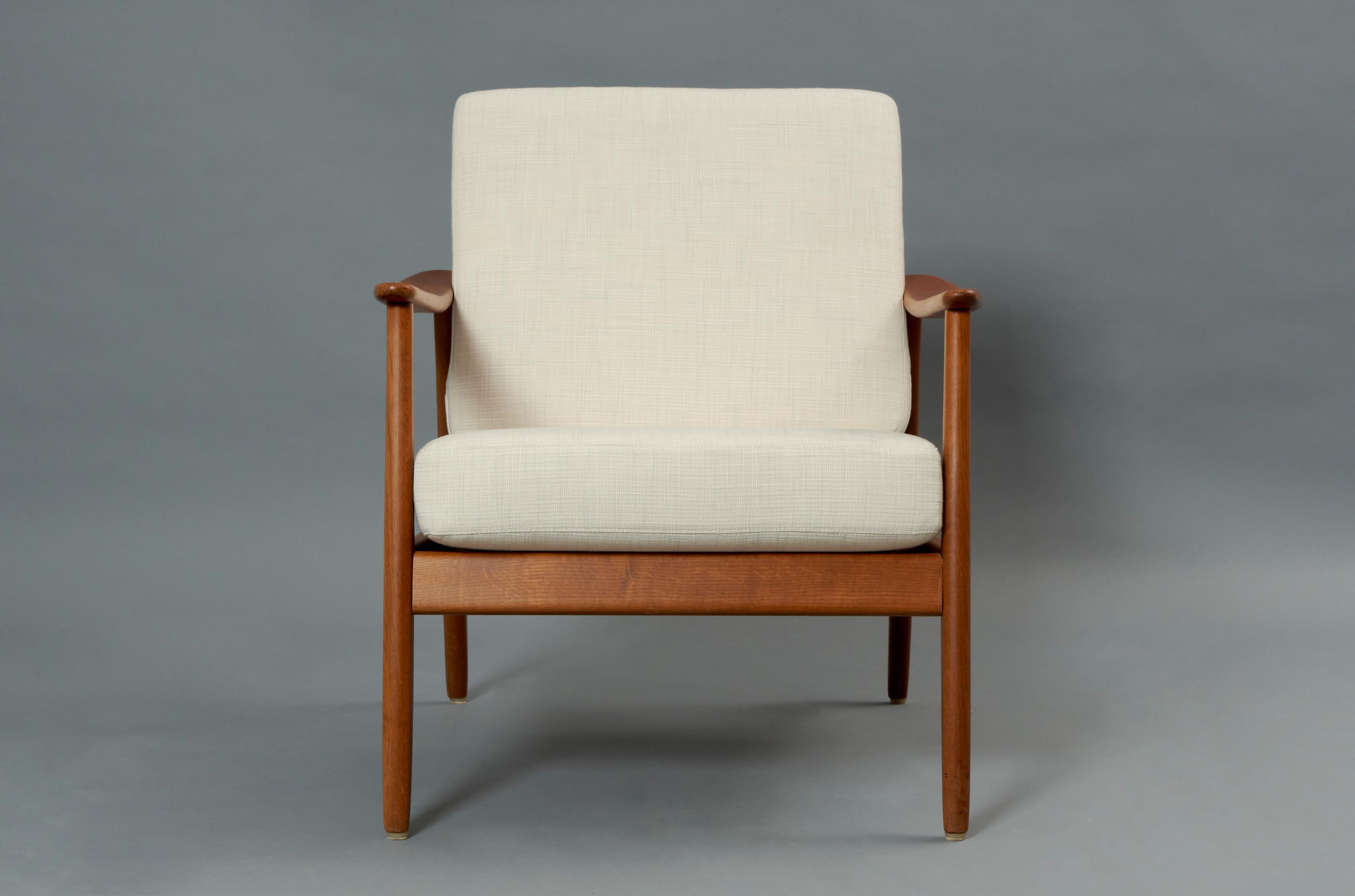 Armchair designed by Folke Ohlsson for Dux in Teak wood and Rattan. Sweden, 1960s.

Excellent restored and reupholstered condition that might present traces of time and use. 

Folke Ohlsson was a Swedish designer considered one of the most