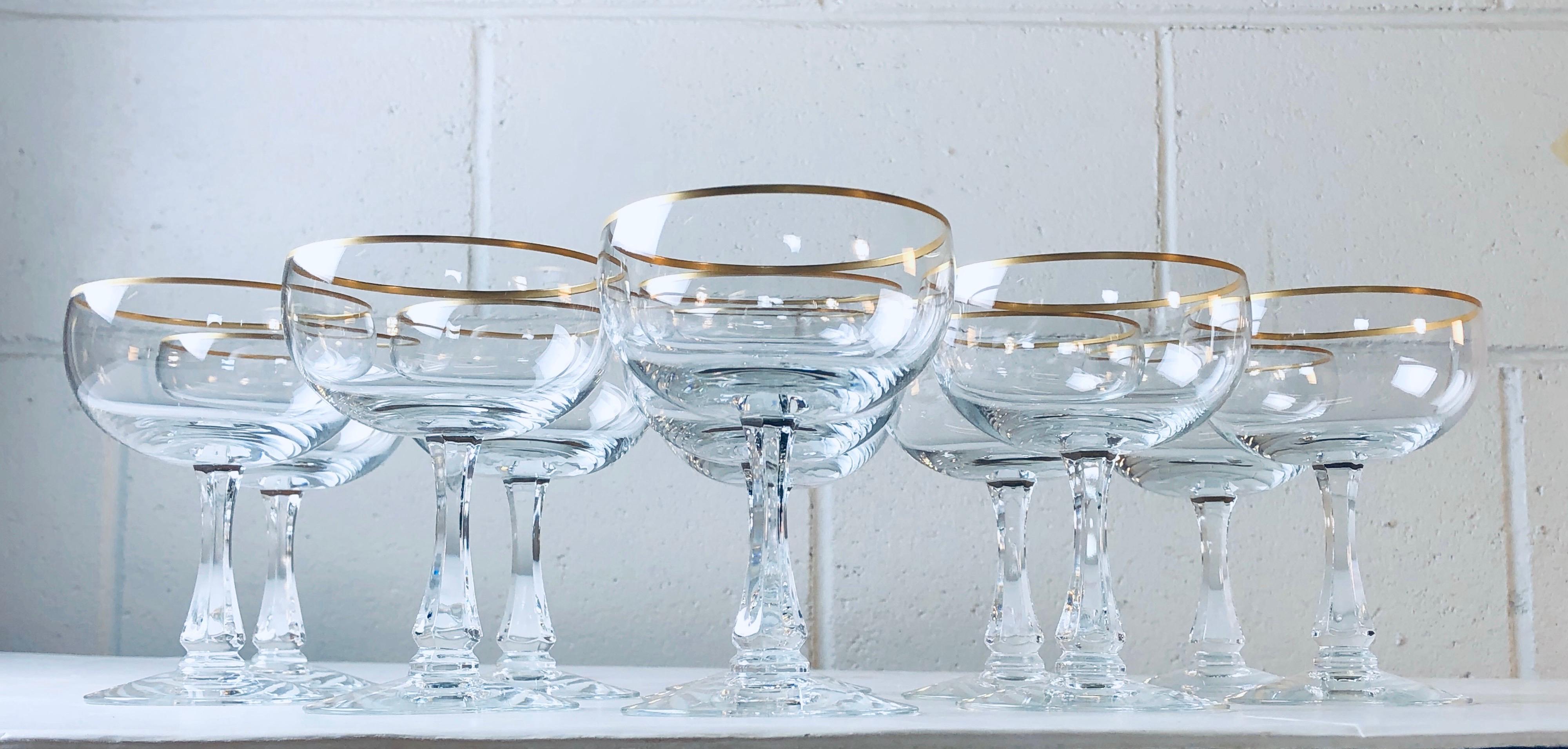 Vintage 1960s set of 11 Fostoria glass gold rim coupes. Marked underneath. Excellent condition.