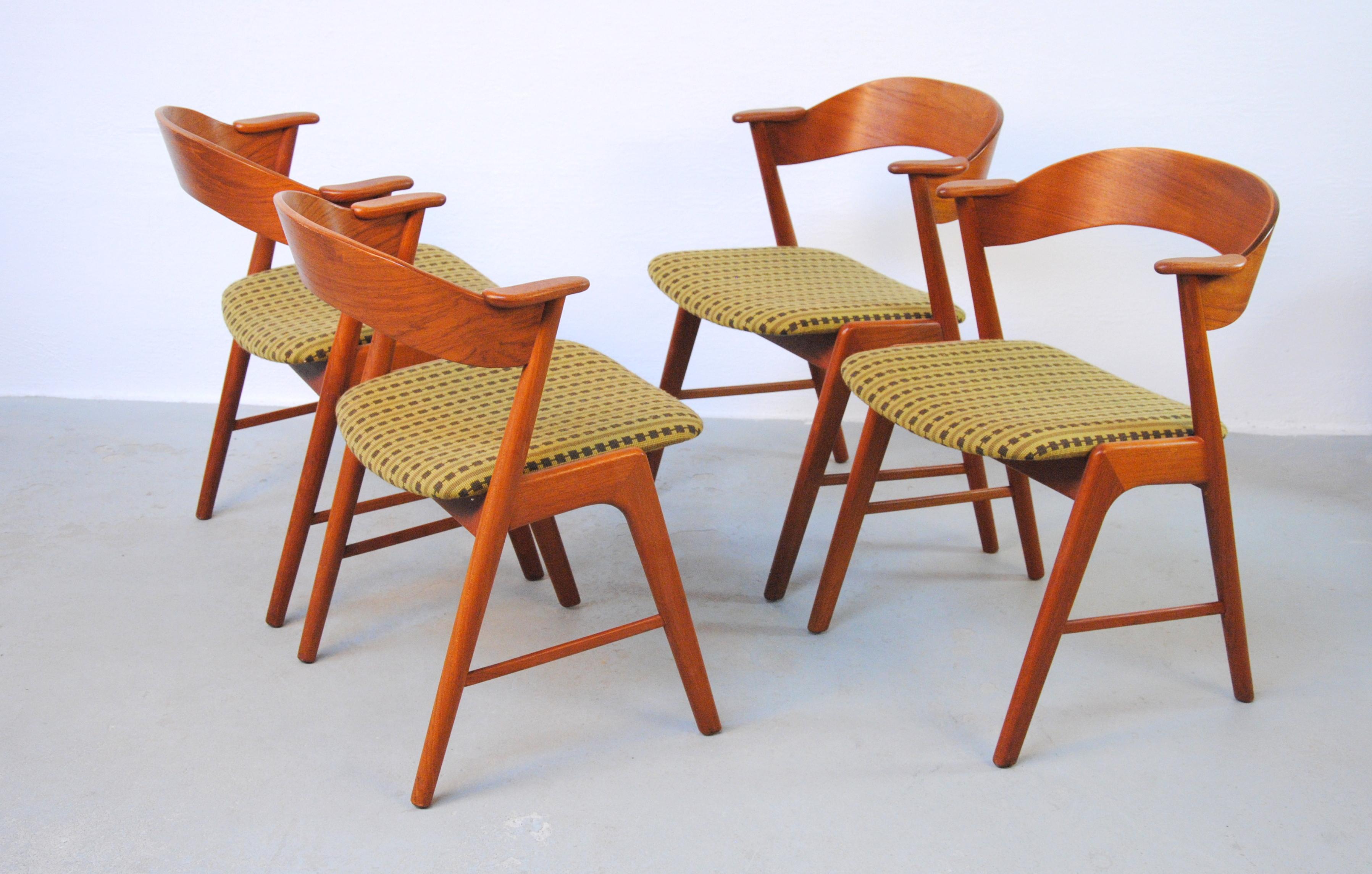 Set of Four Danish dining chairs in teak with curved backrests and elegant frames manufactored by Korup Stolefabrik. The chairs are commonly known as model 32 and by many attributed to Kai Kristiansen - though he himself denied having designed