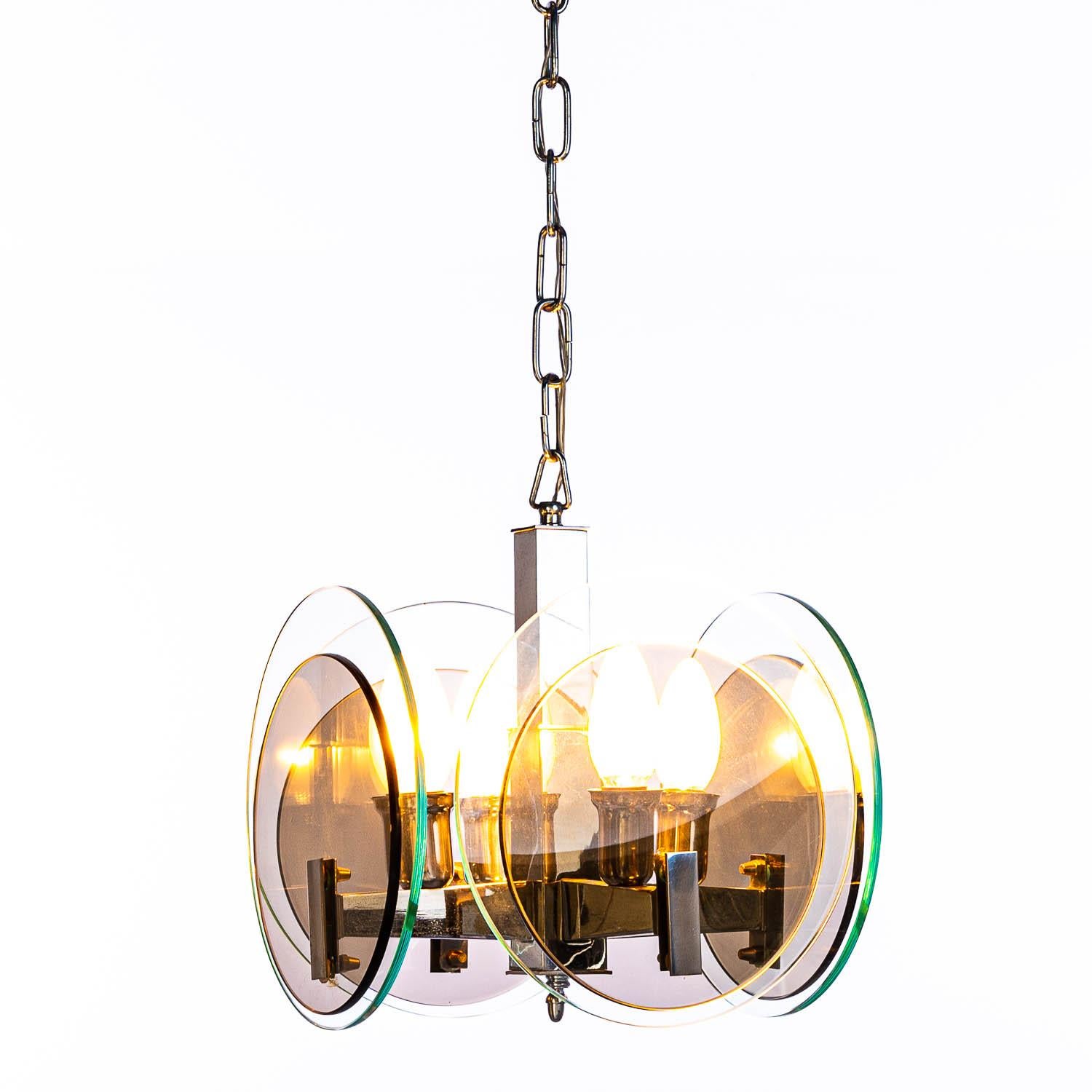 Attributed to Veca four-light pendant, Attached to the chrome centre two circular tinted glass plates.