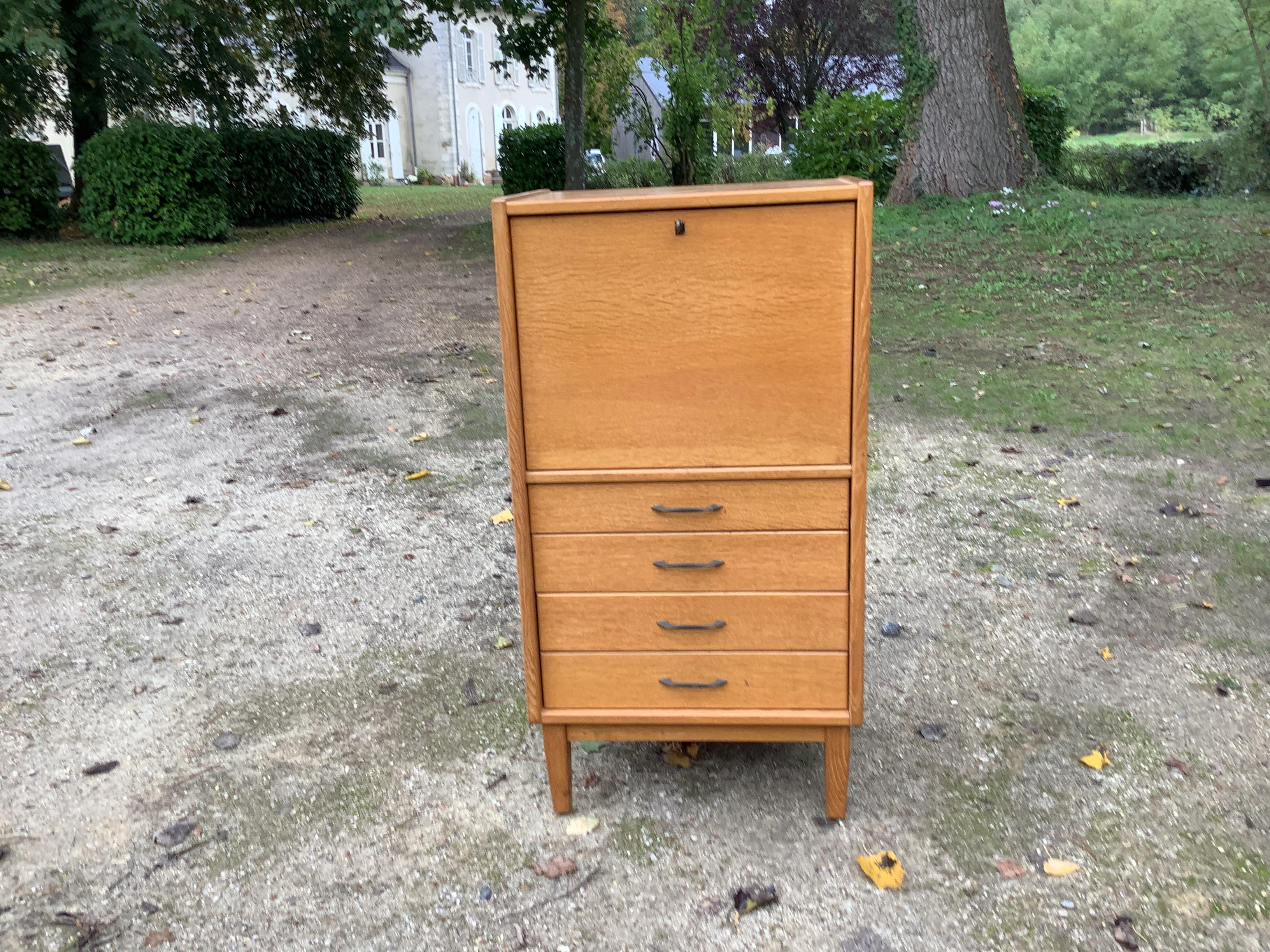 Simple functional Bureau with excellent storage draws finished in light oak
Cc 1960.