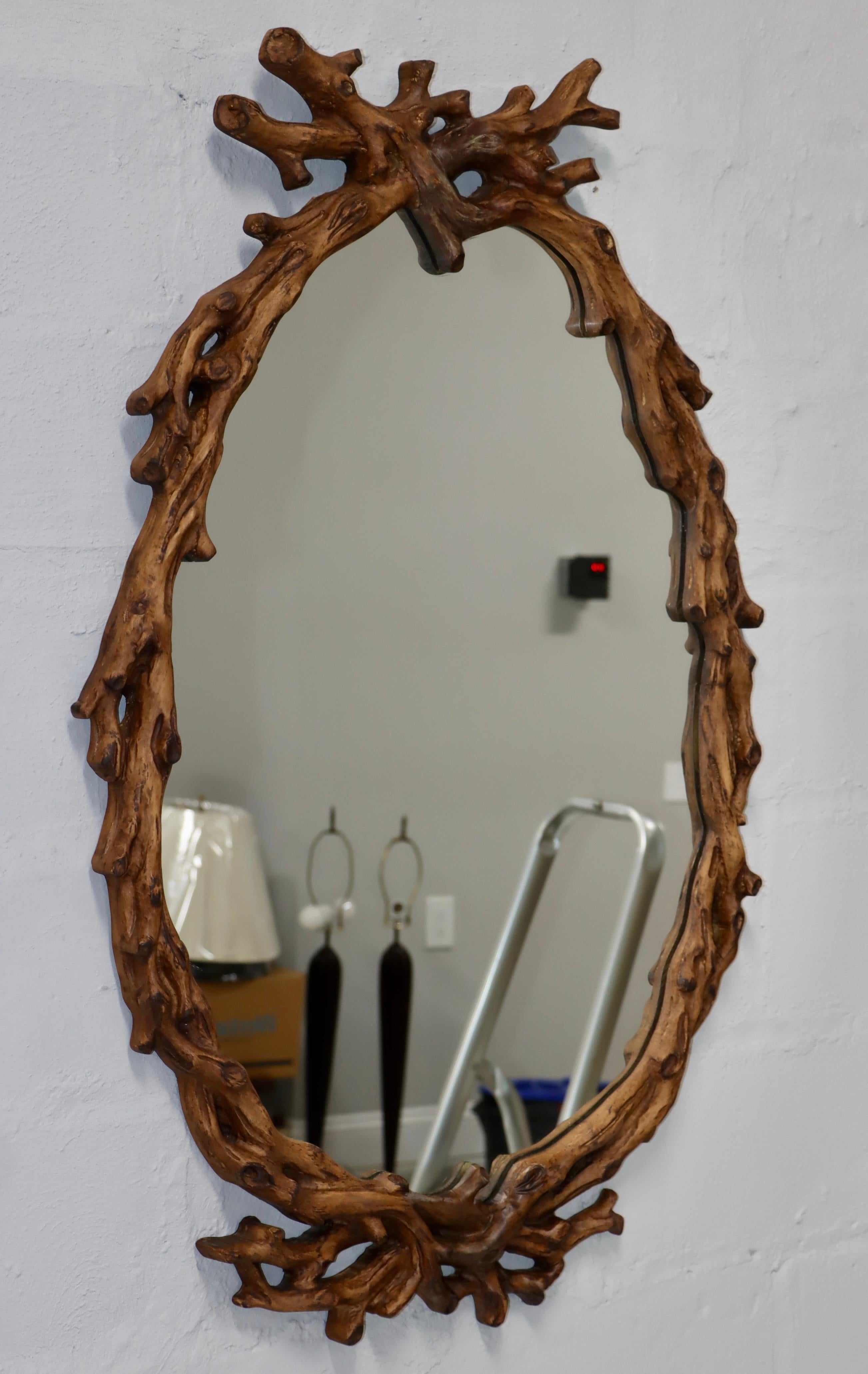 1960's mid-century modern wall mirror by Francisco Hurtado with branches motif, in vintage condition with minor wear and patina due to age and use.