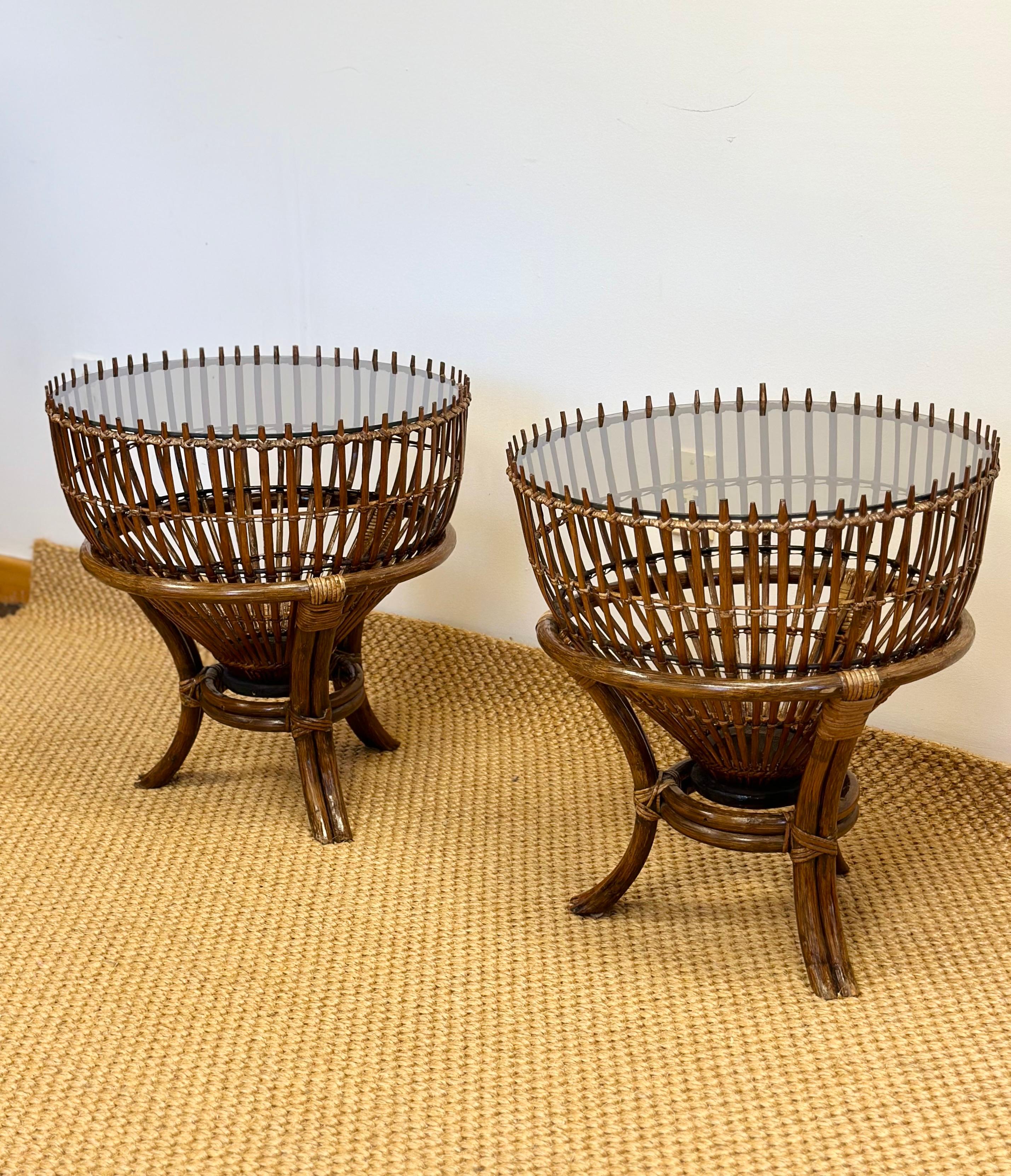 We are very pleased to offer a pair of tables attributed to Franco Albini, the iconic rattan fishing basket side tables, circa the 1960s.  These exquisite pieces, with their distinctive rounded, open-weave rattan structure perfectly blend
