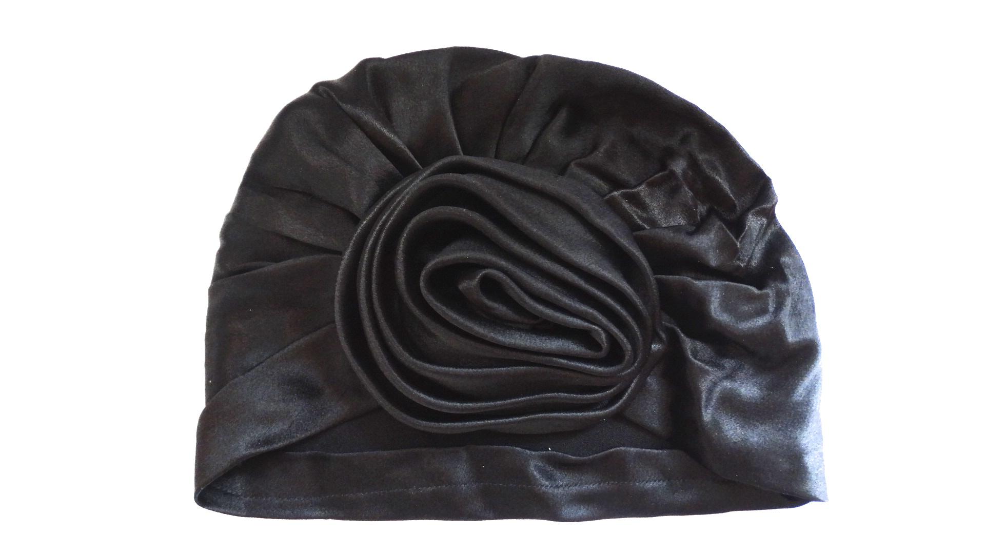 We love a good turban- and you will too with our adorable Frank Olive hat circa the 1960s! Black satin fabric, classic turban construction with gathered three dimensional rose effect at the front. Pulls onto the head effortlessly- no tying required!