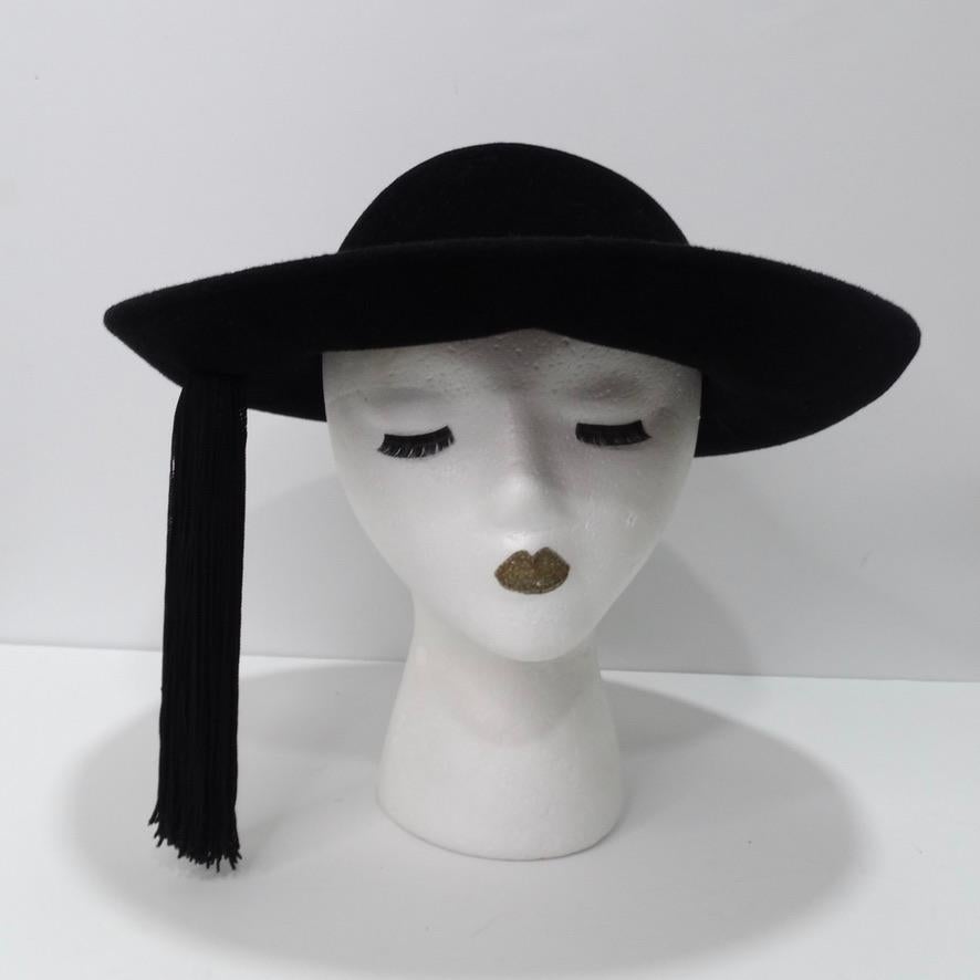 Wow! This gorgeous vintage Frank Olive cartwheel hat circa 1960s is so special and chic! In an extremely sophisticated 'cartwheel' style featuring a black tassel hanging off the side which adds such a unique flare to an otherwise classic shape. Pair