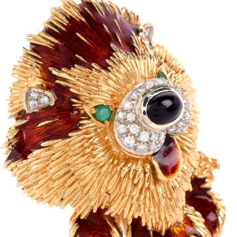 This famouse Frascarolo brooch pin is rendered in 18-karat textured yellow gold simulates a stylized version of a handsome dog, with a pair of round emeralds simulating the animal's eyes, an oval cabochon black onyx, surrounded by pave diamonds the